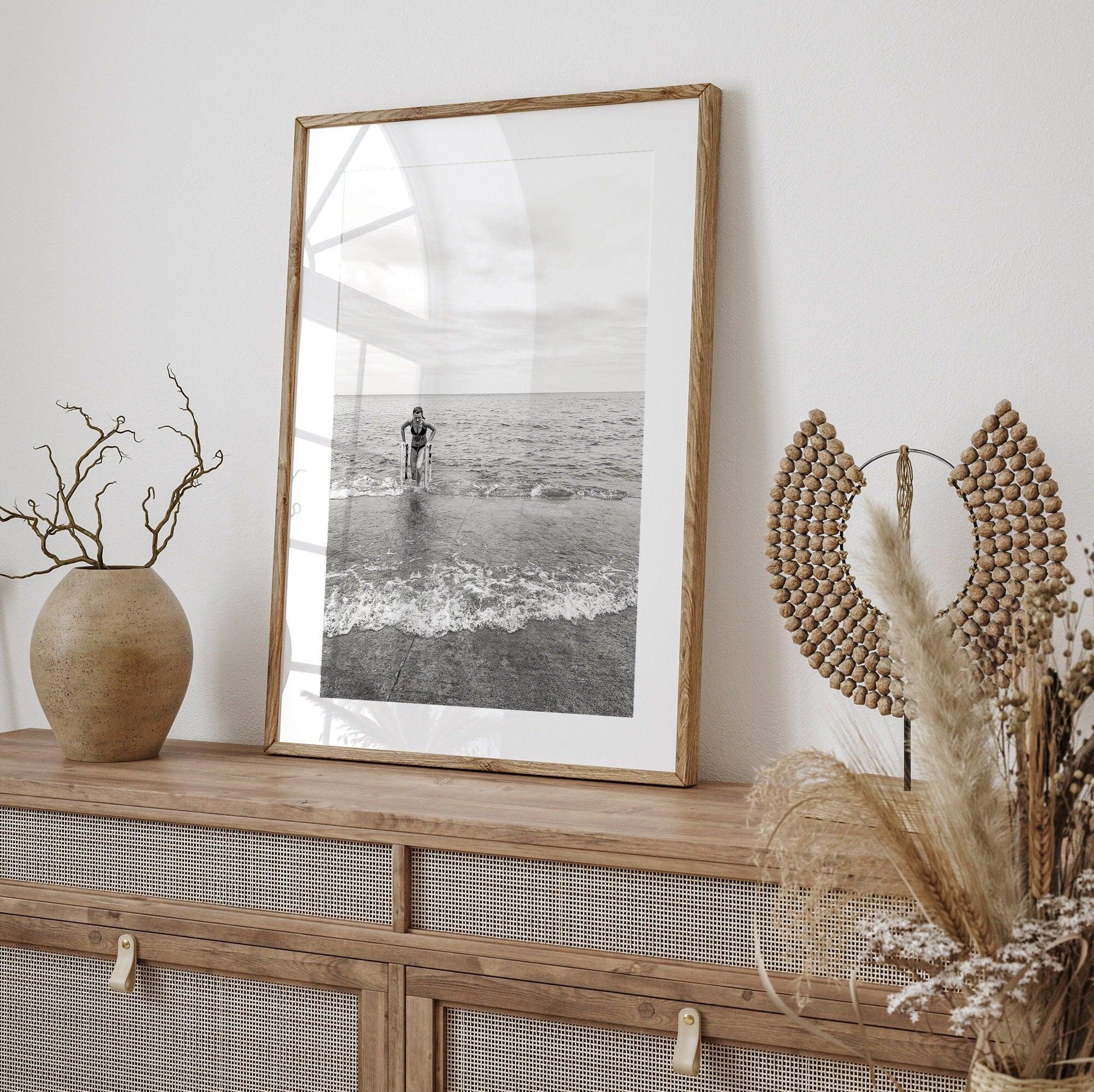 A black and white fine art lake beach print of a beach in Chicago on the coast of Lake Michigan showcasing a woman bathing in the lake. The classic modern look of the print is sure to impress when hung on your walls.