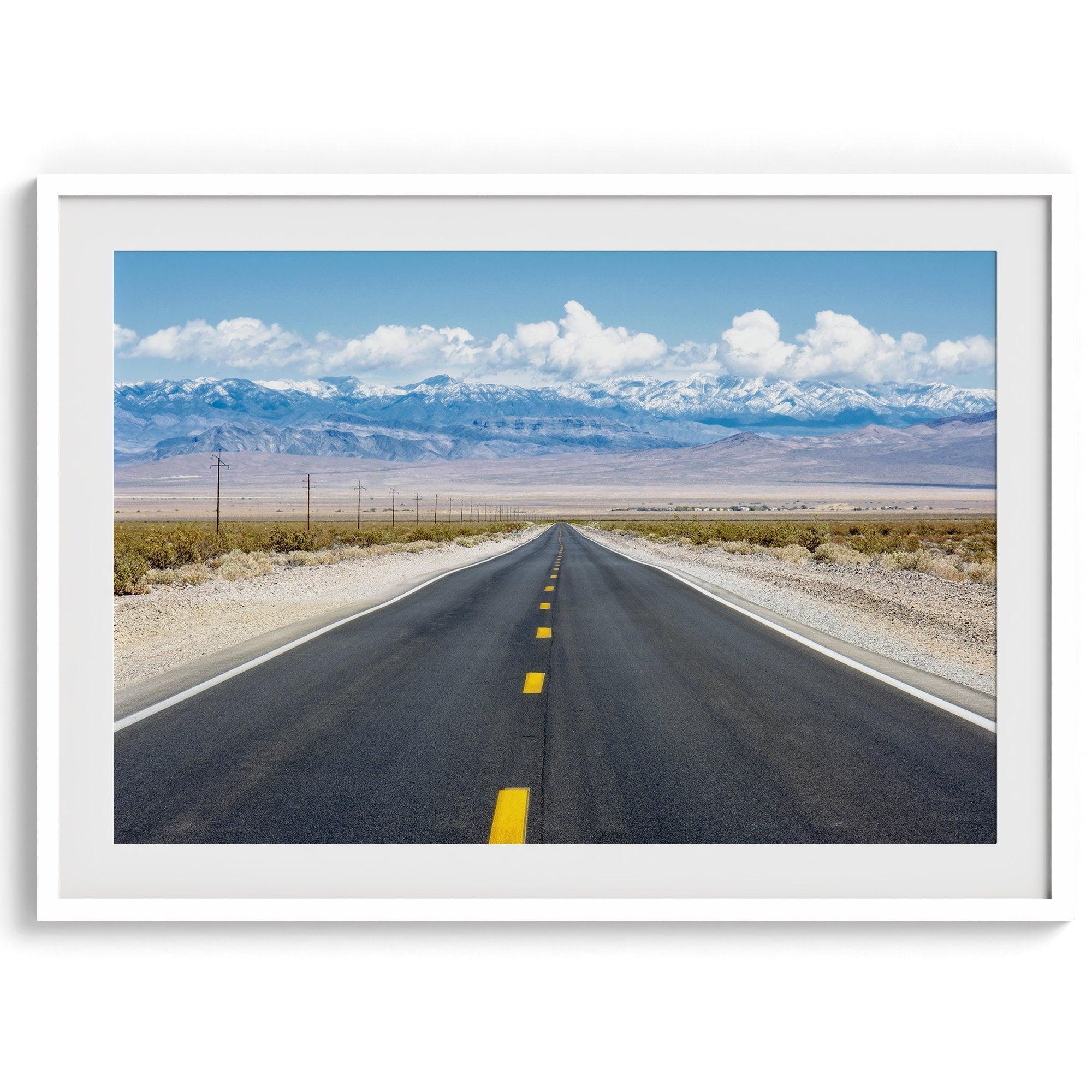 This stunning piece of desert wall art will take your breath away. This beautifully framed picture of a Death Valley National Park road leading towards the snow-covered mountains at the end of the desert will impress when hung on your walls.