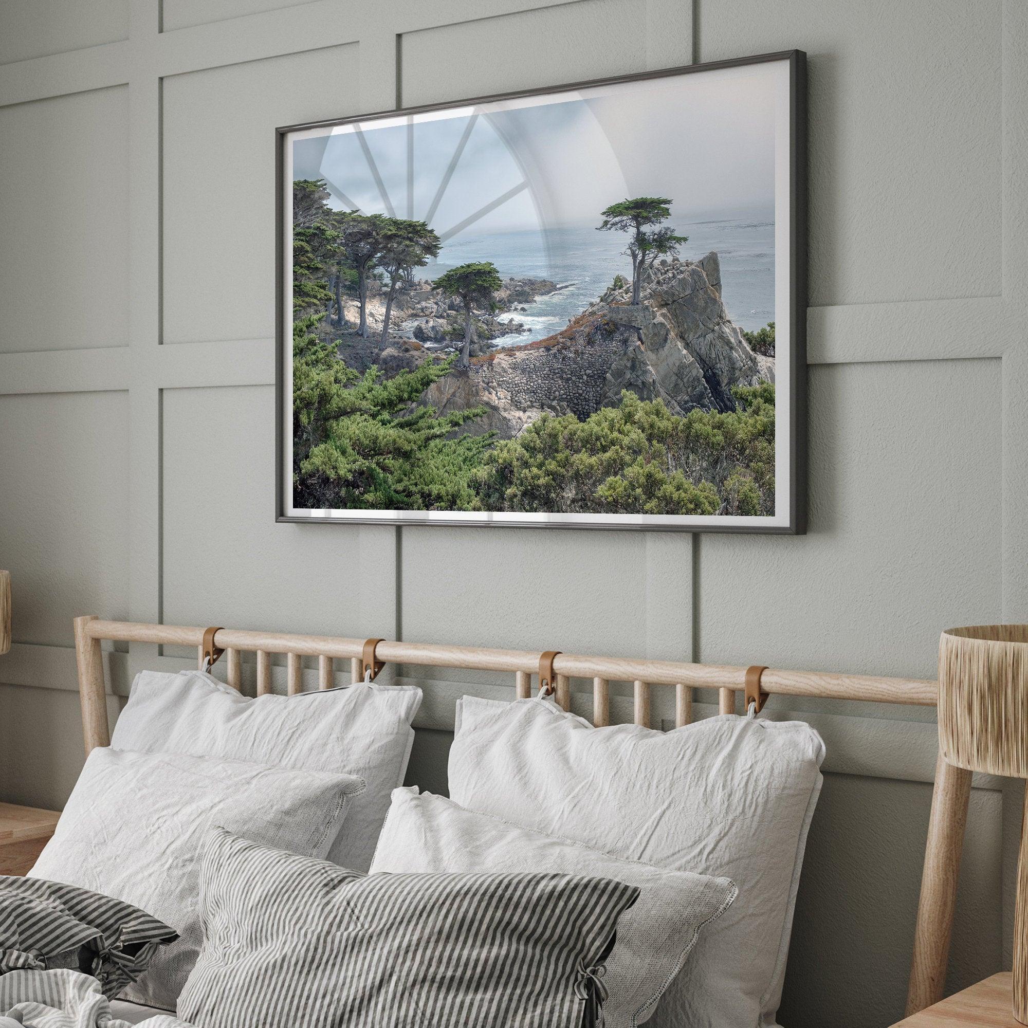 A fine art coastal print showcasing a lone cypress overlooking the ocean in 17 miles drive near Monterey, California. This ocean wall art is available framed or unframed.