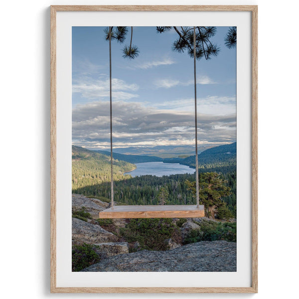 A fine art-inspiring photo print showcasing a swing on a tree with the backdrop of Donner Lake and the Pacific Northwest mountains.