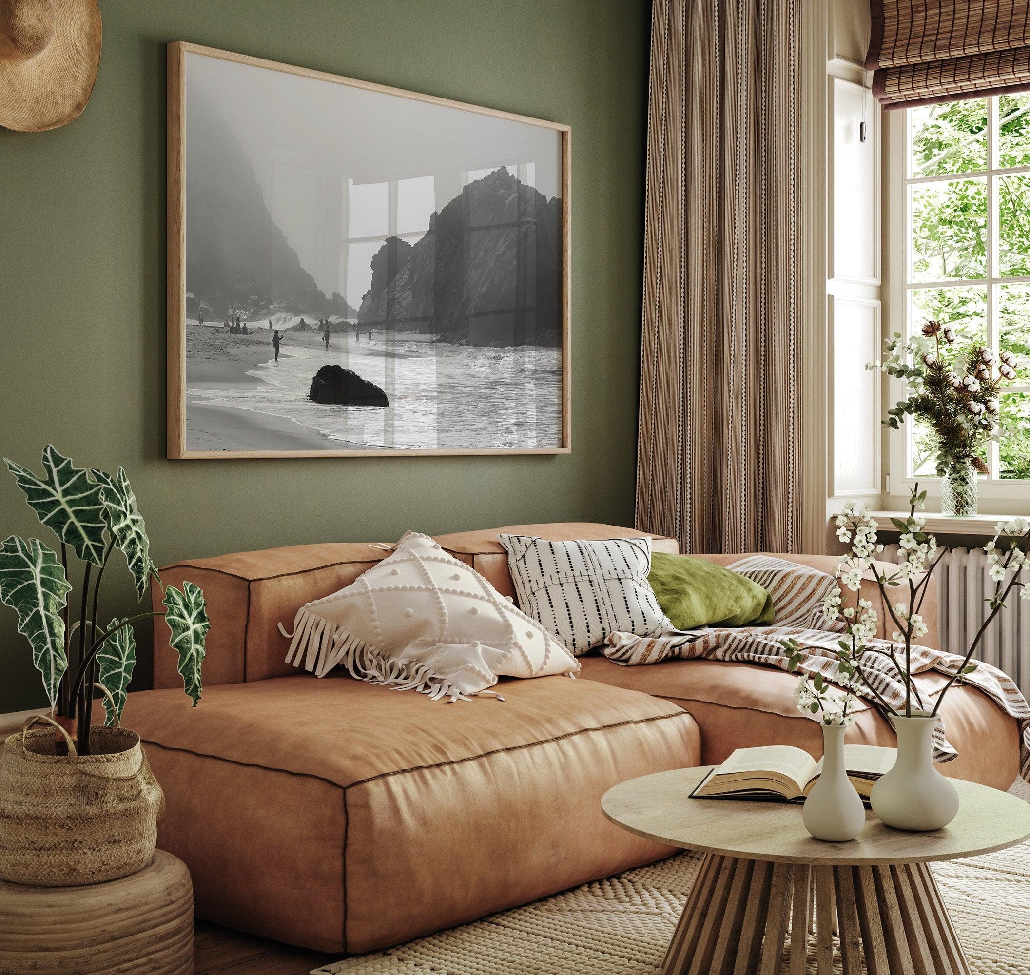 A framed black and white print of the beautiful Pfeiffer Beach in Big Sur hung in the living room. This wall art showcases the dramatic rocks and mist of the Big Sur coastline and the day-to-day life of the beach.