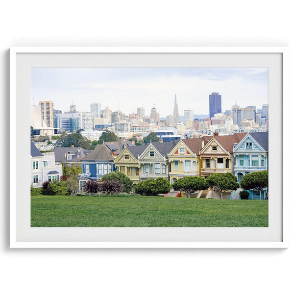 A fine art framed print of the famous colorful painted Ladies Victorian houses in Alamo Square, San Francisco.