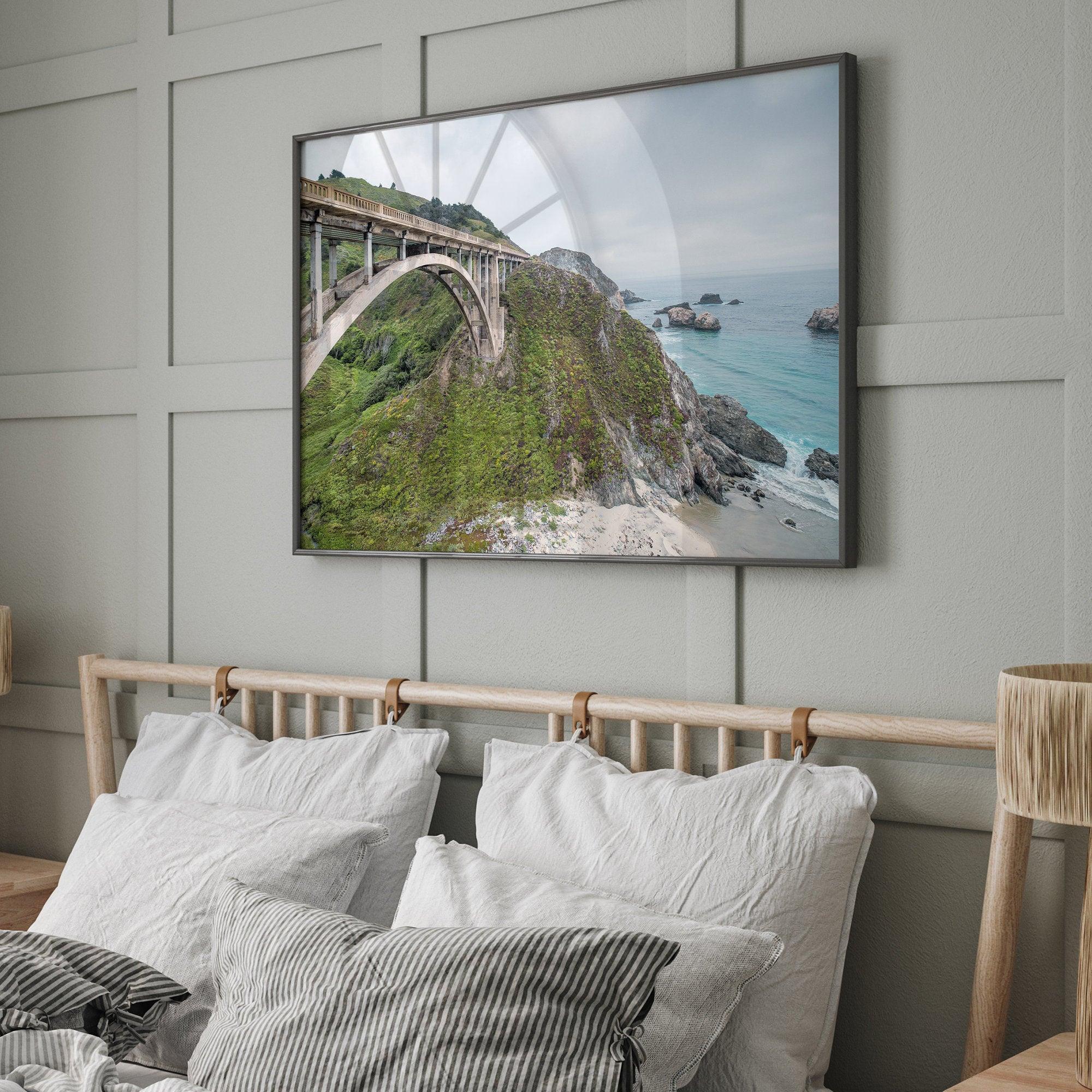 A fine art ocean print of one of the most iconic spots in the famous Route 1 in California - Bixby Bridge near Big Sur. Shot in a unique wide angle that captures the bridge, cliffs, the ocean, and the stunning beach below.