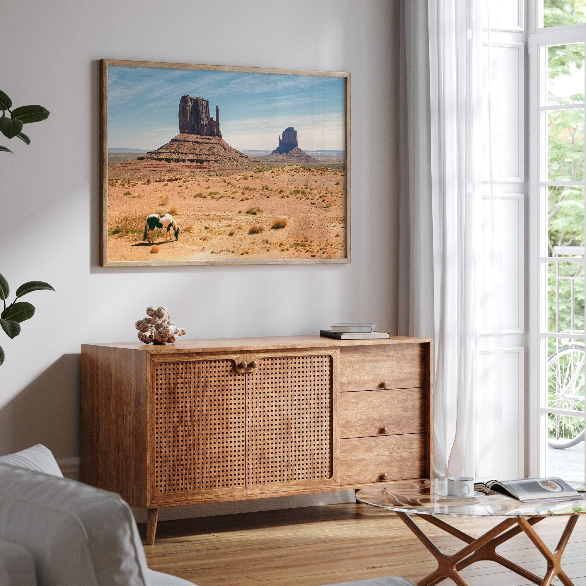 A framed or unframed fine art photography desert print of a horse in Monument Valley, Utah. This wall art features unique rock formations native to the Monument Valley area. This horse wall art comes in different sizes, including extra large.