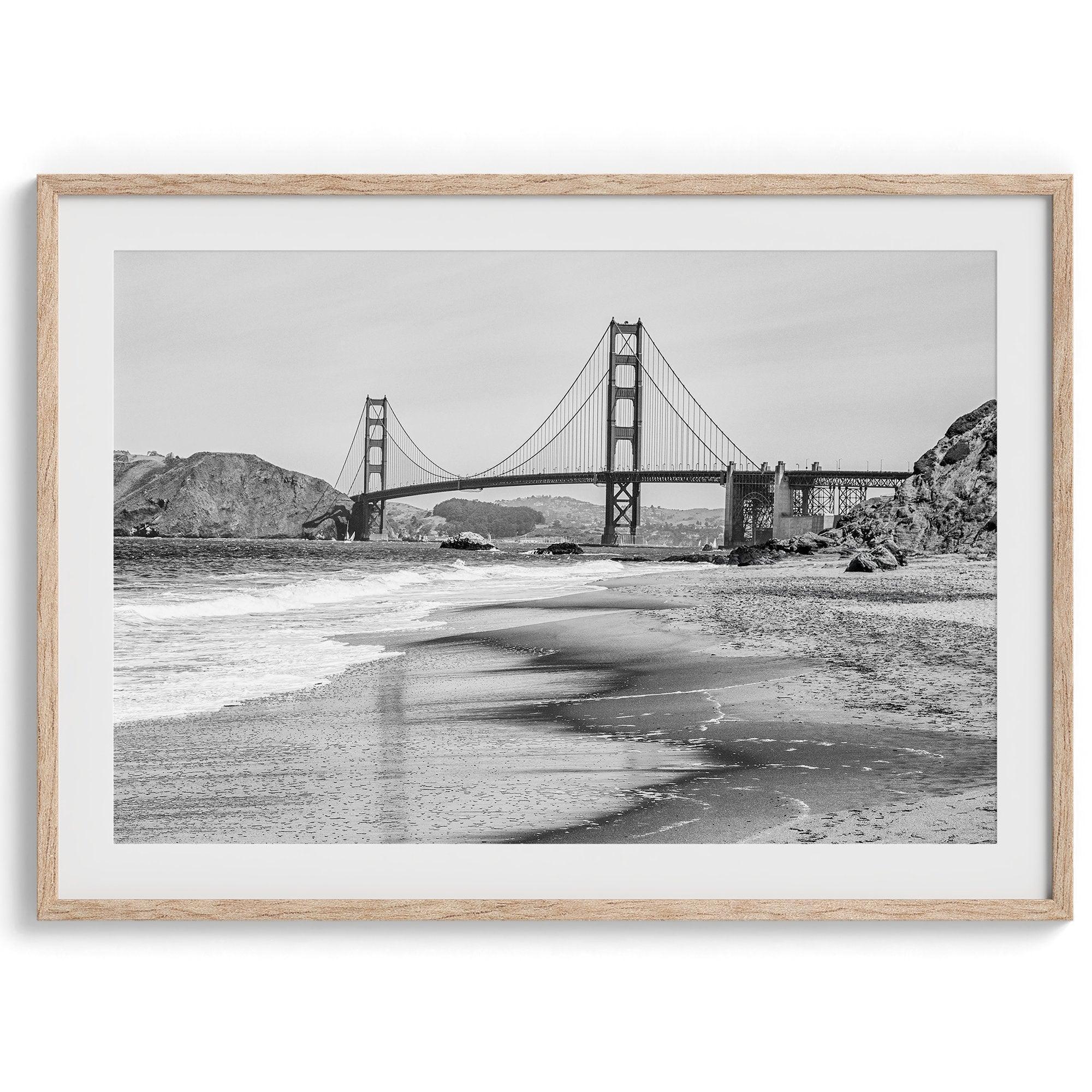 Fine art black and white print of Golden Gate Bridge from Baker Beach, San Francisco. Bridge with reflection in beach surf. Framed or unframed option available