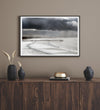 This fine art ocean photography print was taken in Pismo Beach, California, and showcases a distant view of an ocean pier and stormy clouds. Looking long and hard, you can see tens of surfers around the pier.
