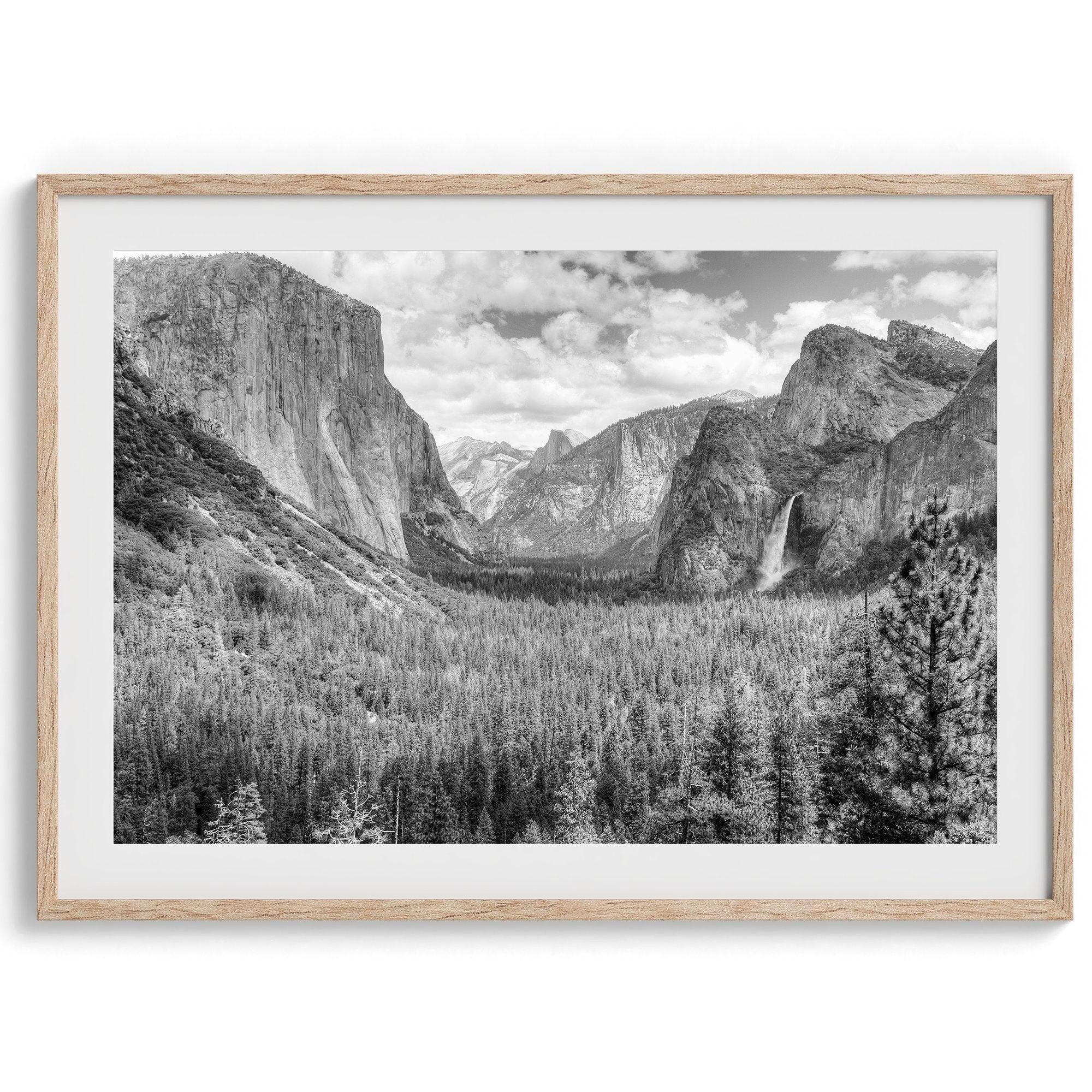 A breathtaking fine art black and white print of Yosemite valley during spring when the waterfalls are in full power.