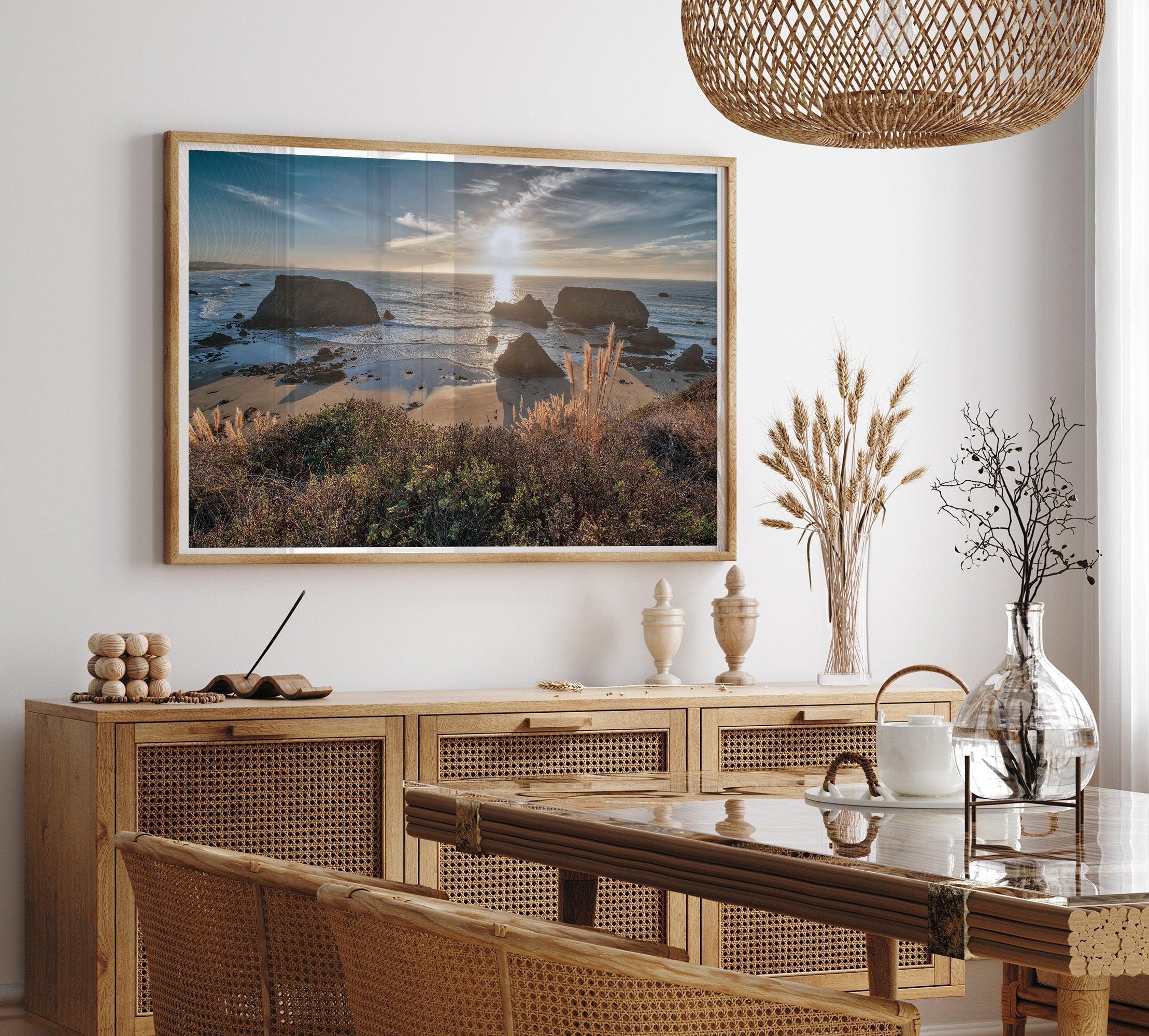 A fine art unframed or framed beach print showing the breathtaking beach of Fort Bragg, California, as the sunset ray of lights hits the ocean and the vast sea stacks.