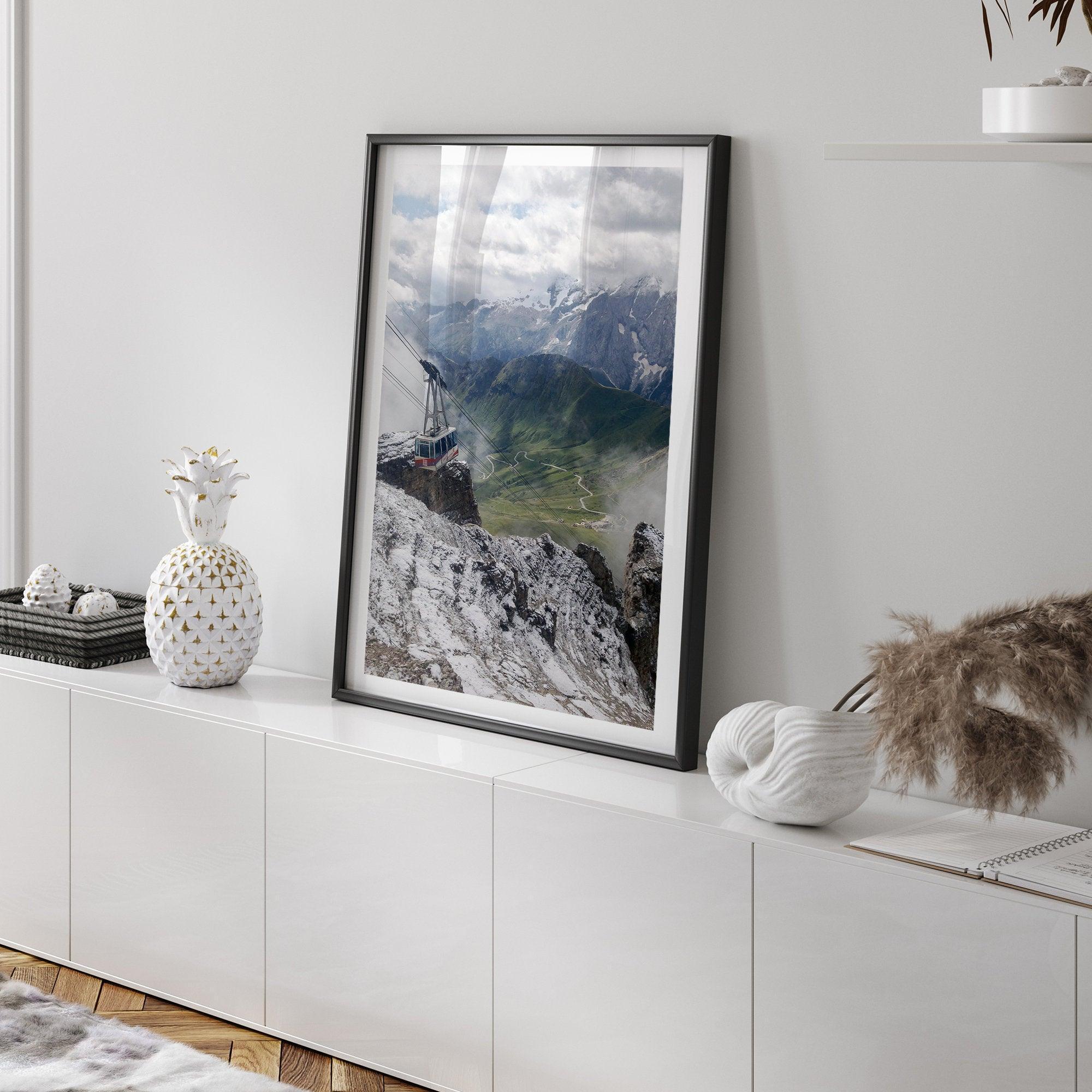 Step into the breathtaking view from the top of Pordoi Pass in the Dolomites Mountains with this fine art Northern Italy photography print. This mountain wall art showcases the green valley and snow-covered mountains.