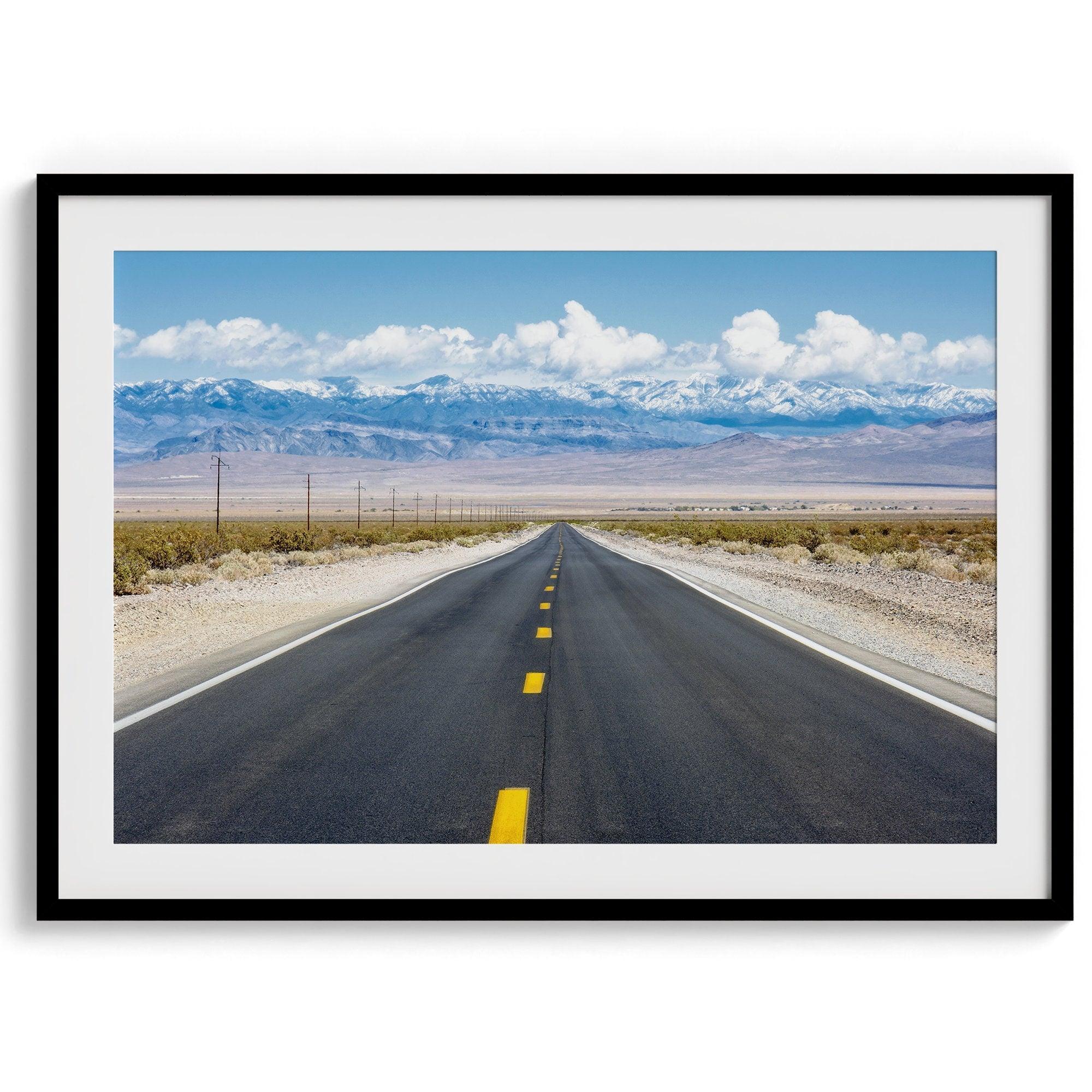 This stunning piece of desert wall art will take your breath away. This beautifully framed picture of a Death Valley National Park road leading towards the snow-covered mountains at the end of the desert will impress when hung on your walls.