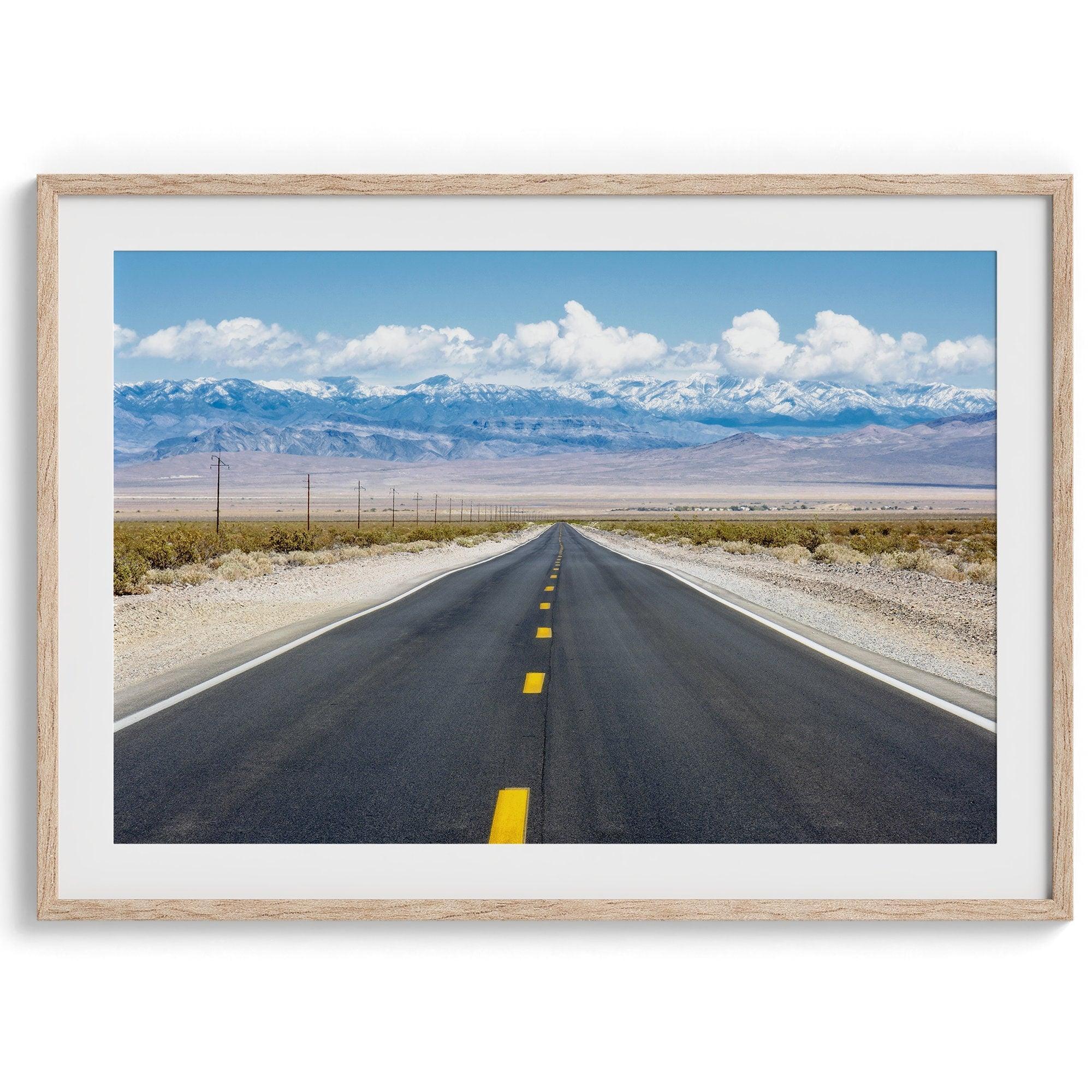 This stunning piece of desert wall art will take your breath away. This beautifully framed picture of a Death Valley National Park road leading towards the snow-covered mountains at the end of the desert will impress when hung on your walls.