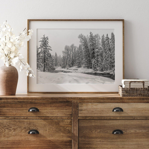 A fine art framed on unframed snowy forest print of forest and river all covered in snow. Taken near Lake Tahoe, California.