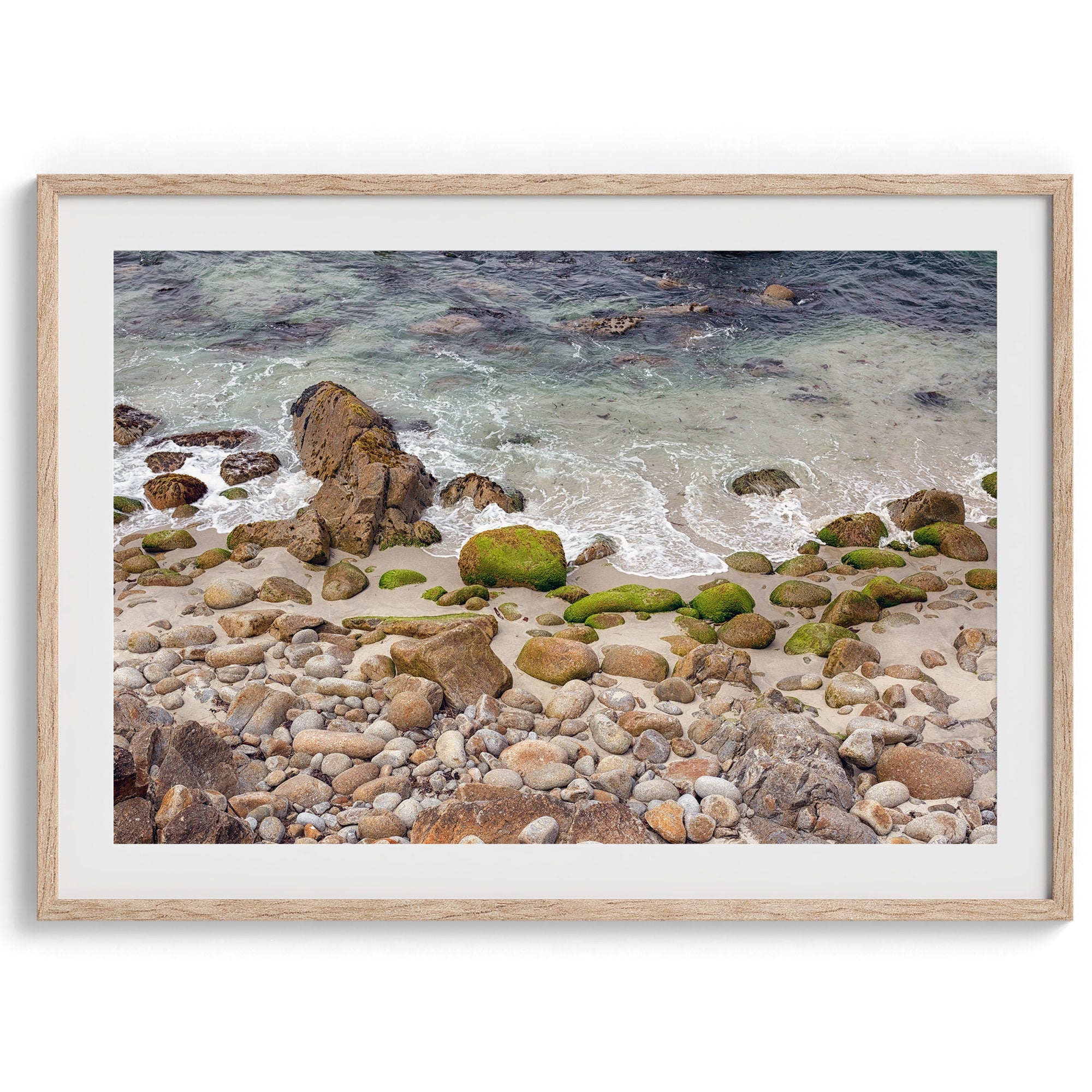 A framed aerial print of a beautiful beach in Pacific Grove, California, near Monterey. This breathtaking fine art aerial photography print captures the awe-inspiring beauty of the California coast.