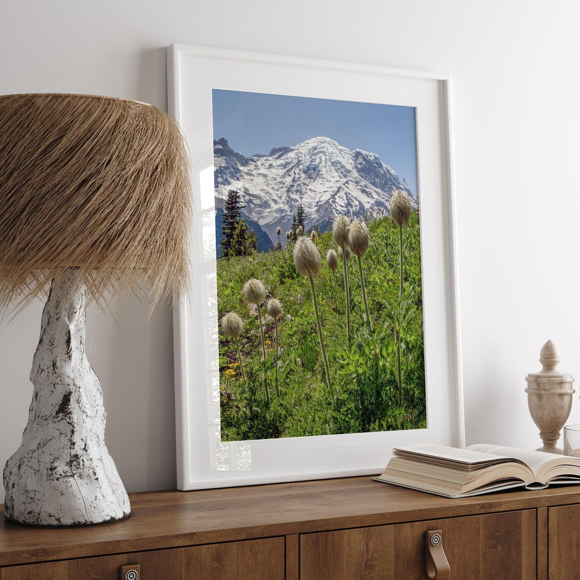 A fine art framed or unframed mountain print of Mount Rainier National Park. This portrait orientation nature landscape wall art showcases the beautiful snow-covered mountain with stunning flowers in the forefront.