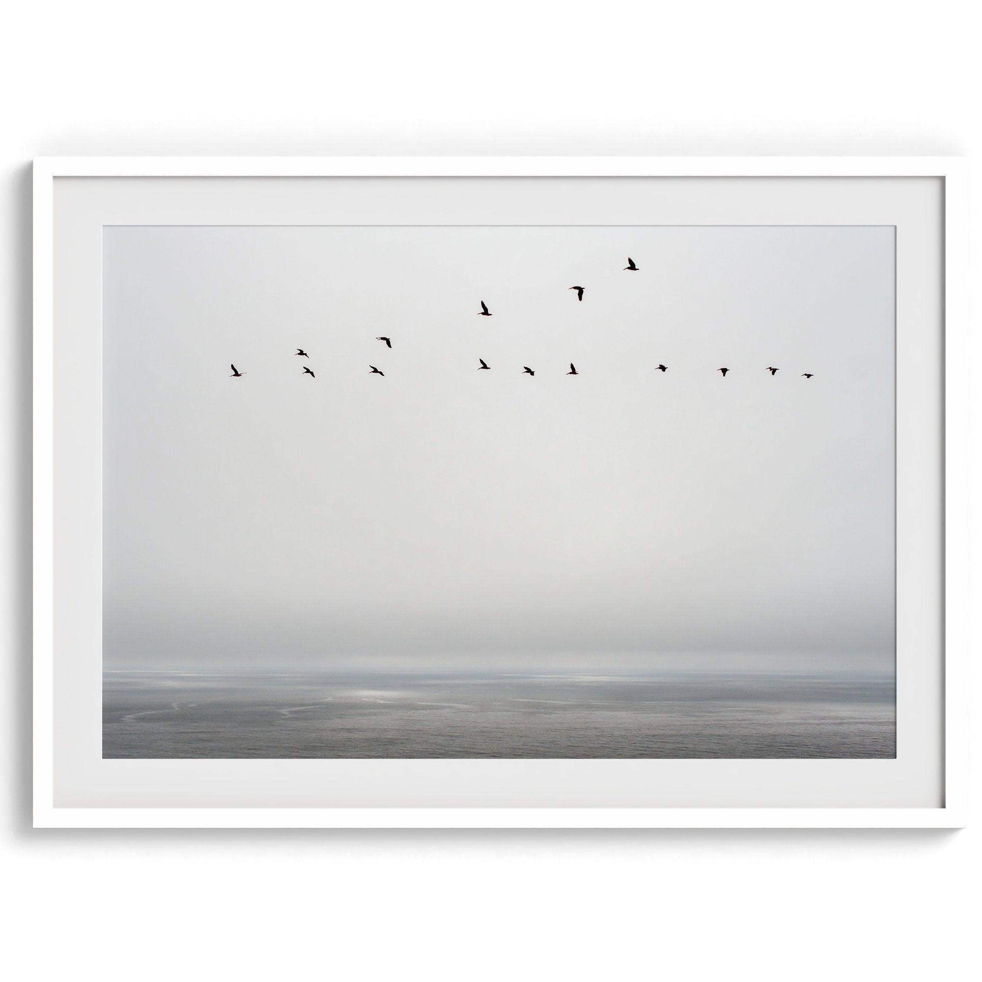 This fine art minimalist ocean print showcases pelicans flying across the Pacific Ocean in Pacifica, California.