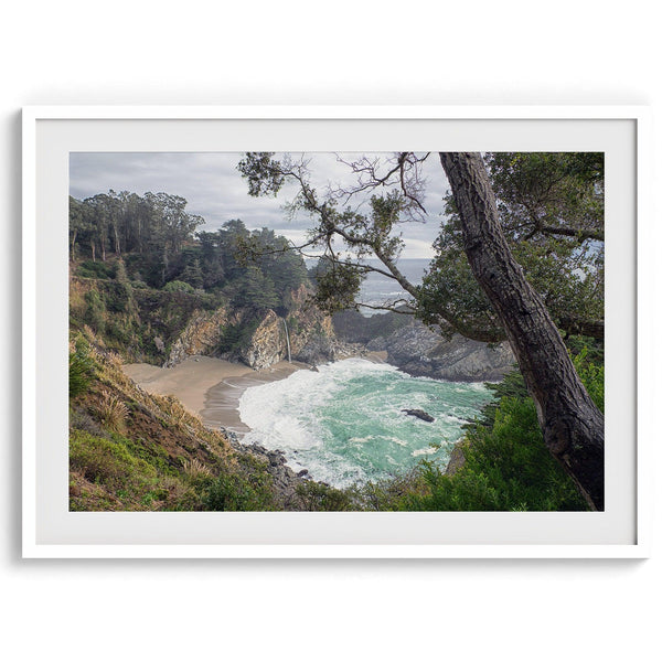 This fine art coastal ocean print features a breathtaking view of Mcway Falls in Big Sur, California, falling to the beach and into the ocean. This fine art photography print captures the beauty and wilderness of nature.