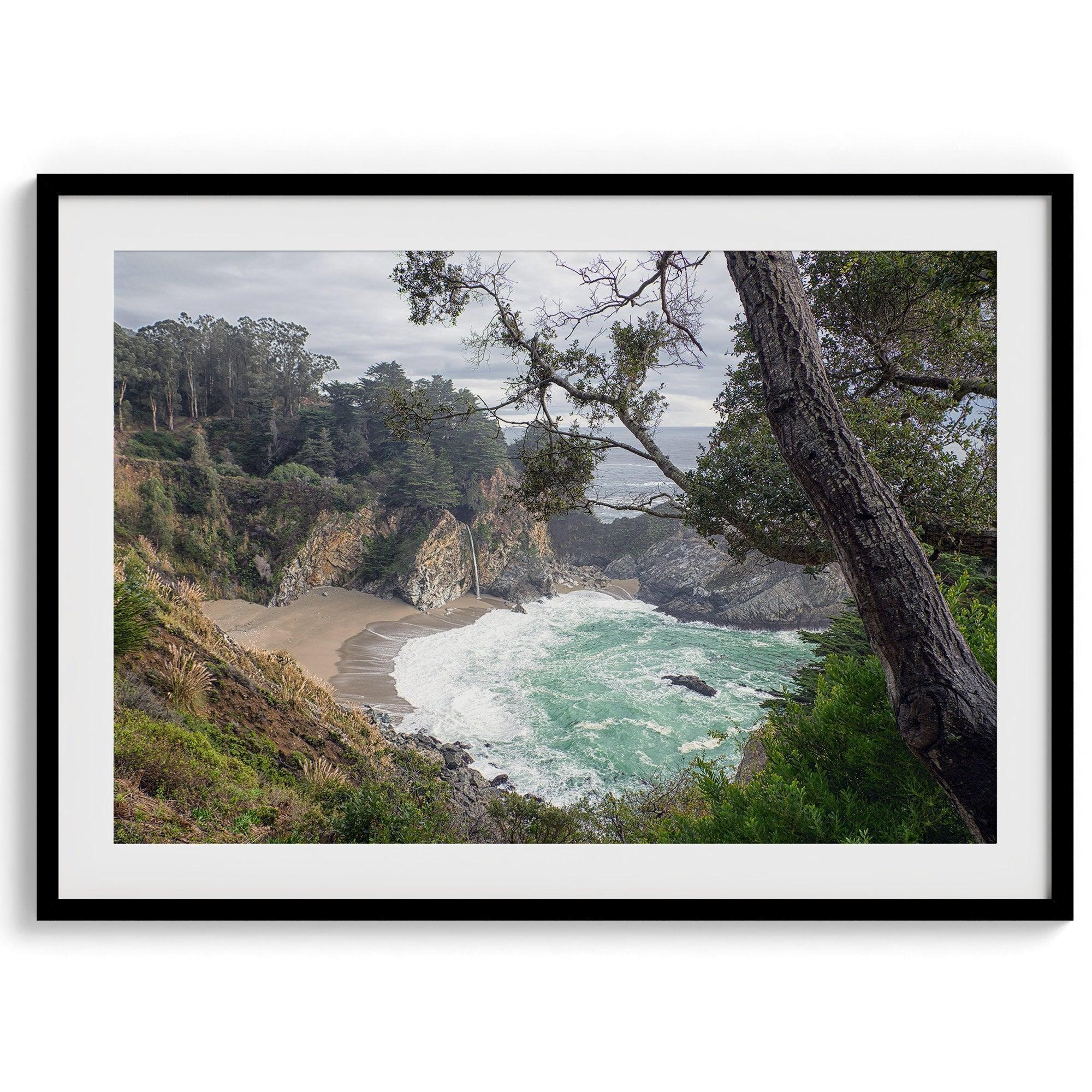 This fine art coastal ocean print features a breathtaking view of Mcway Falls in Big Sur, California, falling to the beach and into the ocean. This fine art photography print captures the beauty and wilderness of nature.