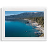 Captivating fine art print of Lake Tahoe showcasing docks, boats, beachfront, lush forest, majestic mountain, and serene waters, capturing the essence of lake life in Incline Village, Nevada.