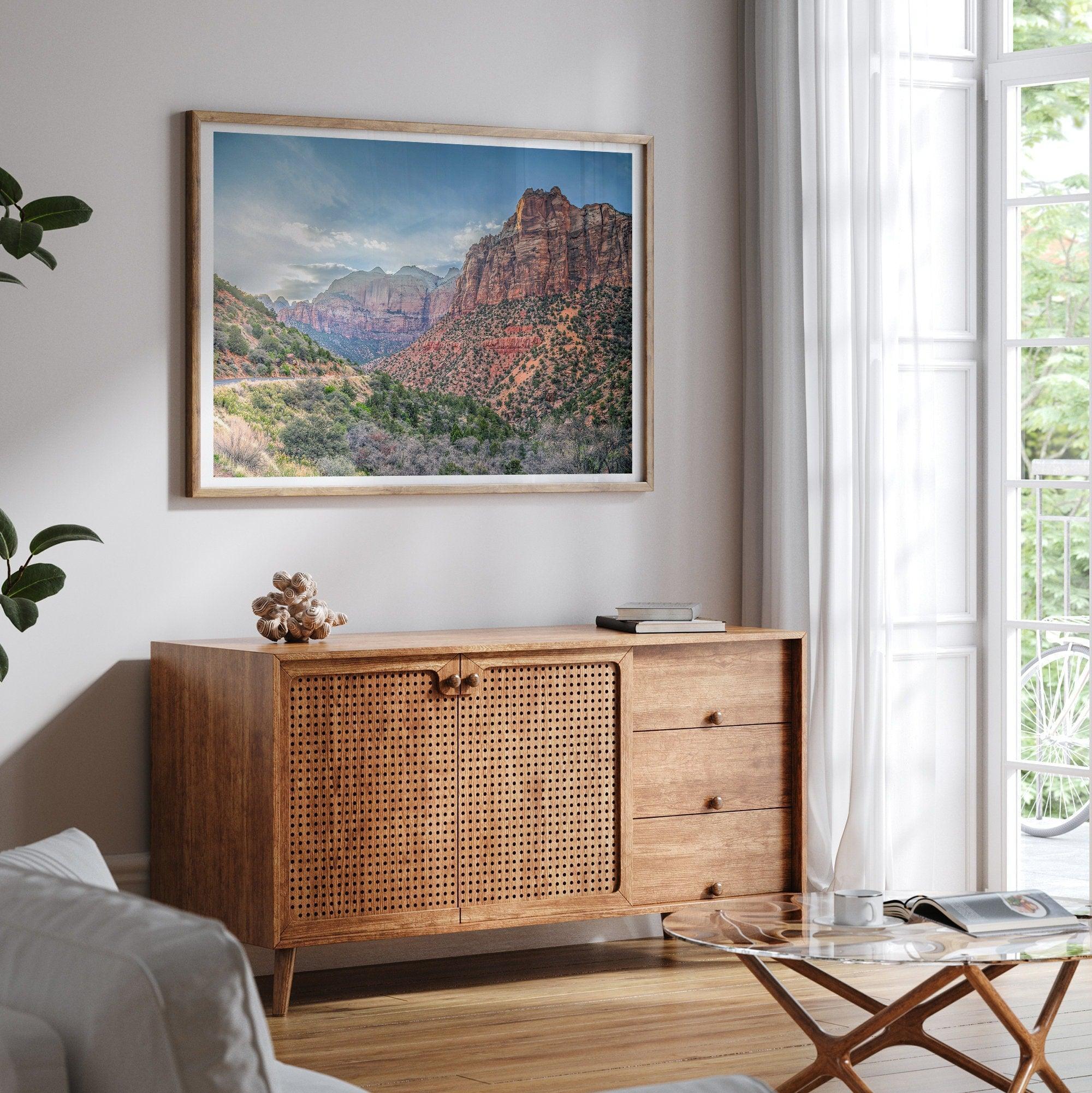 A fine art desert print from Zion National Park showcasing a stunning towering cliff and winding road.