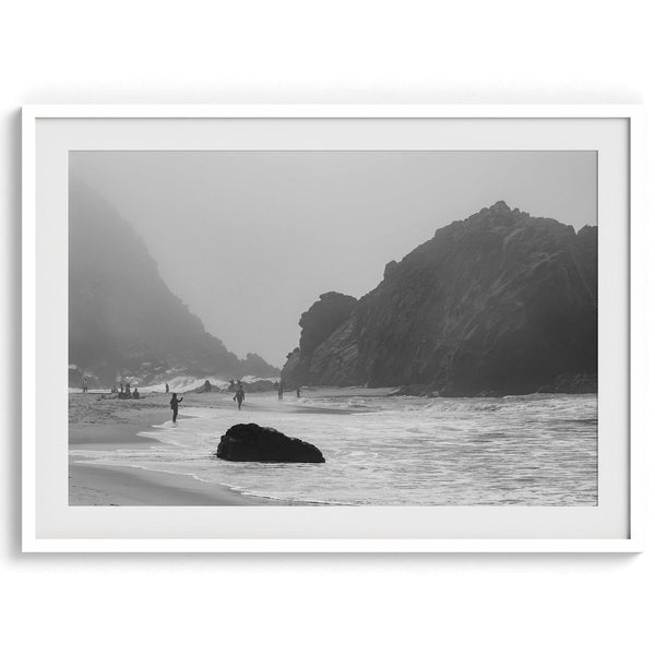 A framed black and white print of the beautiful Pfeiffer Beach in Big Sur hung in the living room. This wall art showcases the dramatic rocks and mist of the Big Sur coastline and the day-to-day life of the beach.