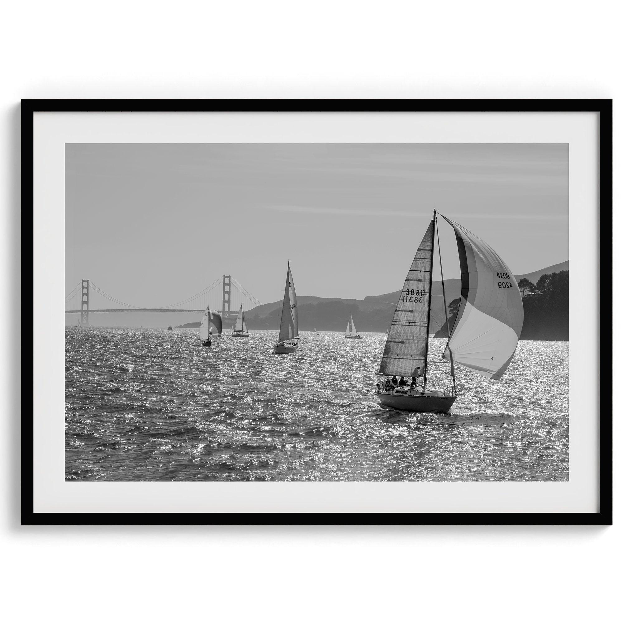 A fine art black and white framed or unframed print of the sailboats in the San Francisco Bay with the backdrop of the Golden Gate Bridge.