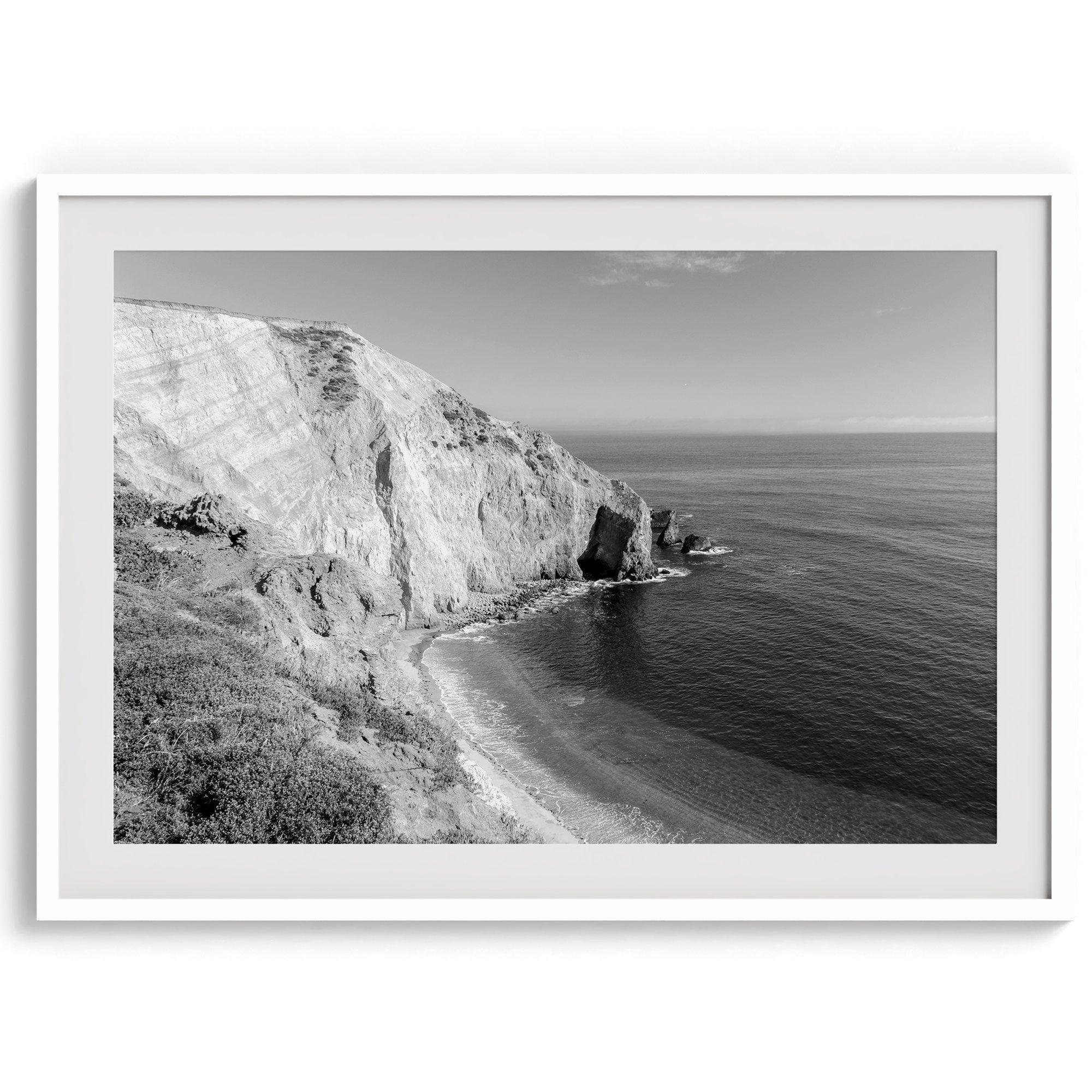 A black and white fine art ocean wall art print of a coastal cliff and beautiful beach in Chimney Rock trail, Point Reyes, California.