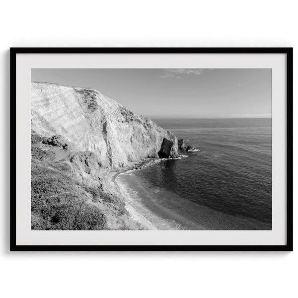 A black and white fine art ocean wall art print of a coastal cliff and beautiful beach in Chimney Rock trail, Point Reyes, California.