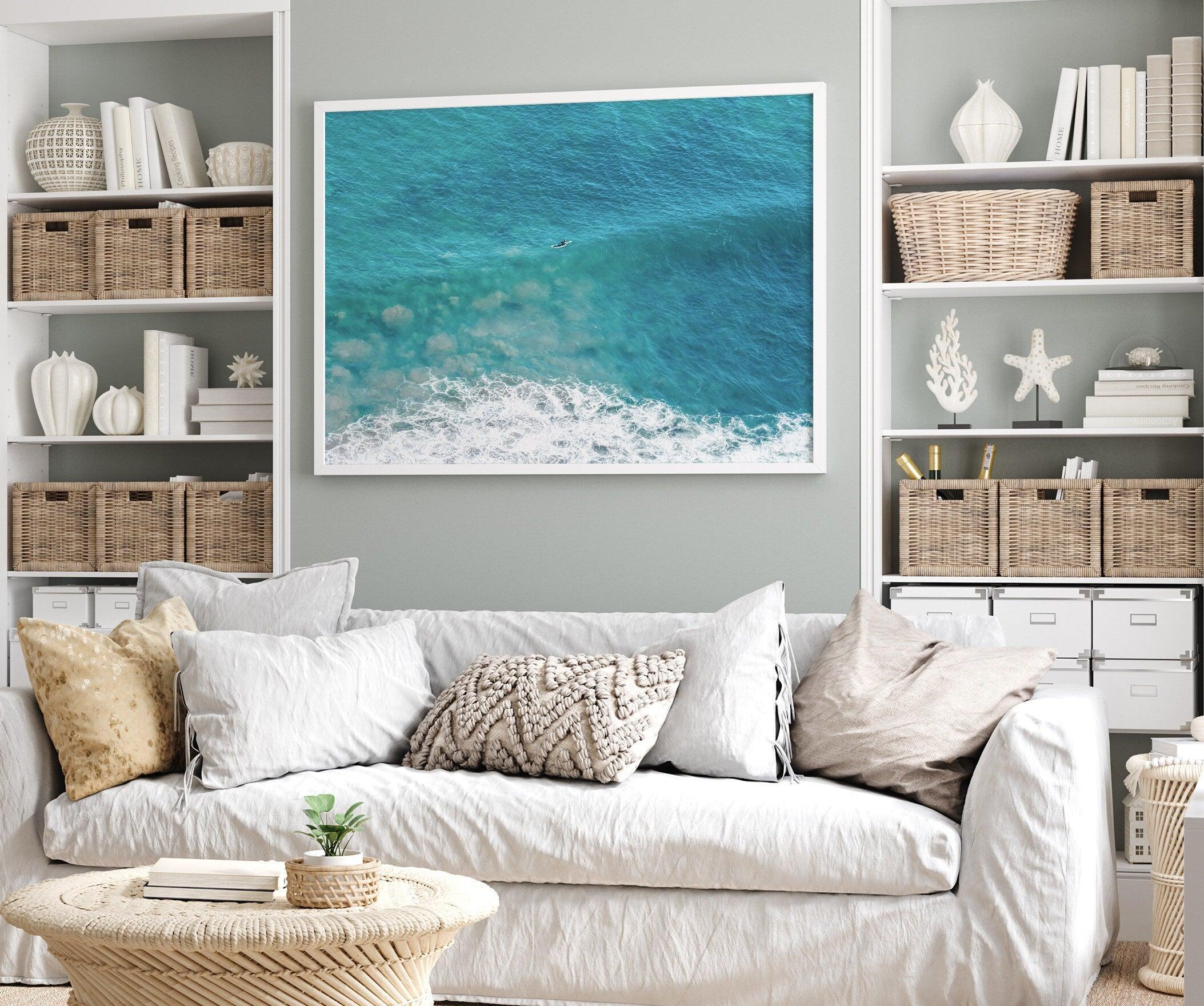 A fine art ocean print of an aerial beach showing a lone surfer with a large wave underneath.