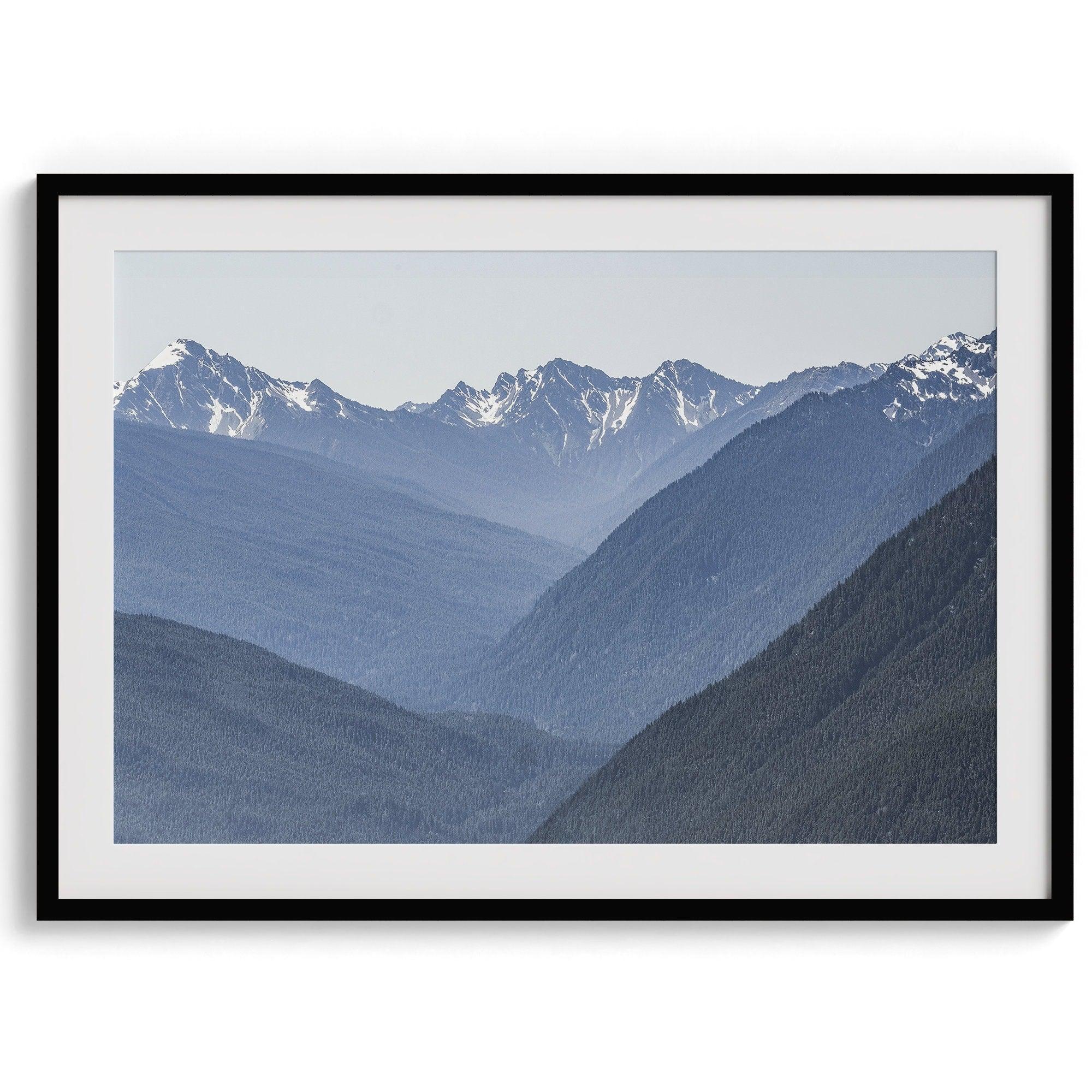 A fine art mountain range print. This mountain wall art showcases the layered misty blue mountains of Olympic National Park in Washington.