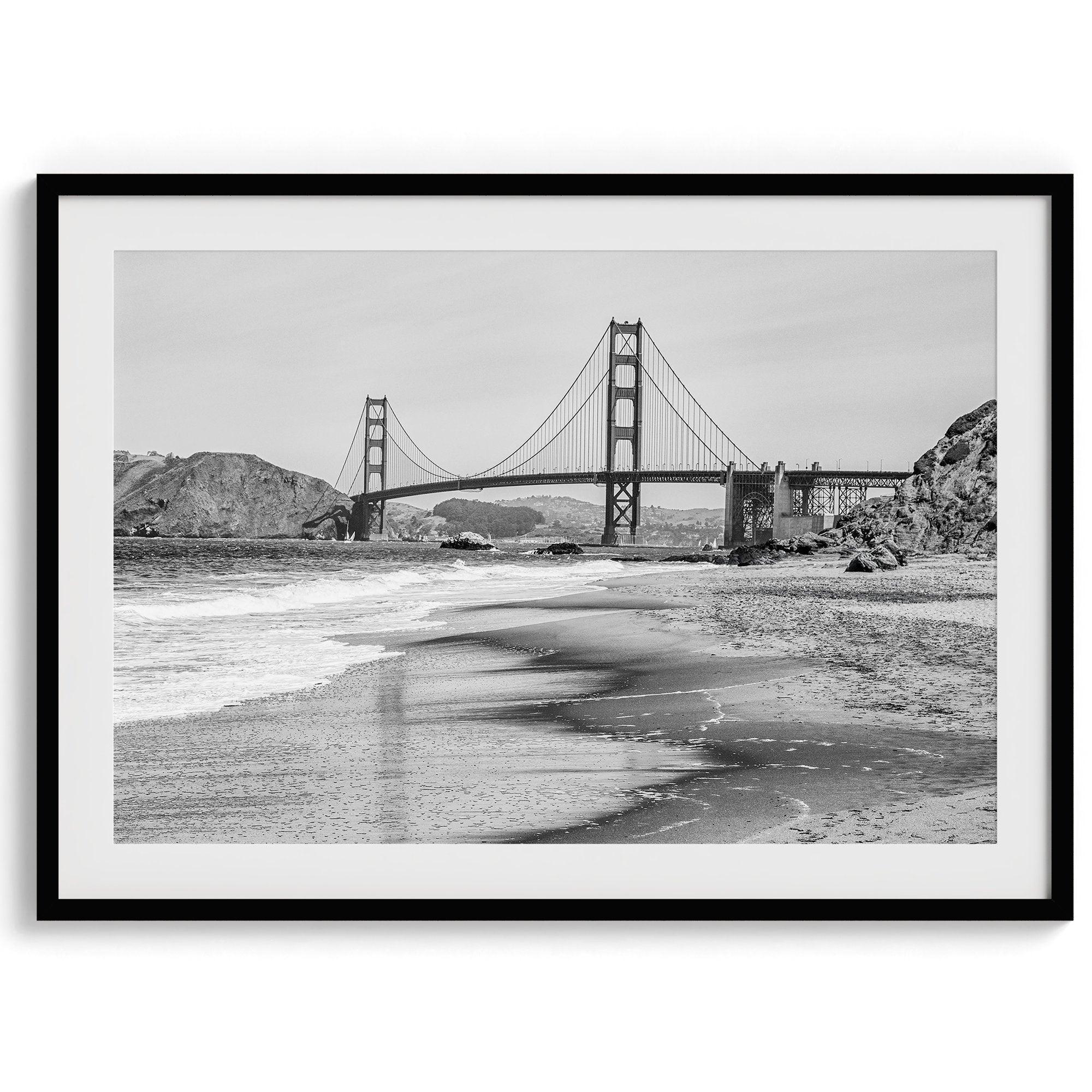 Fine art black and white print of Golden Gate Bridge from Baker Beach, San Francisco. Bridge with reflection in beach surf. Framed or unframed option available