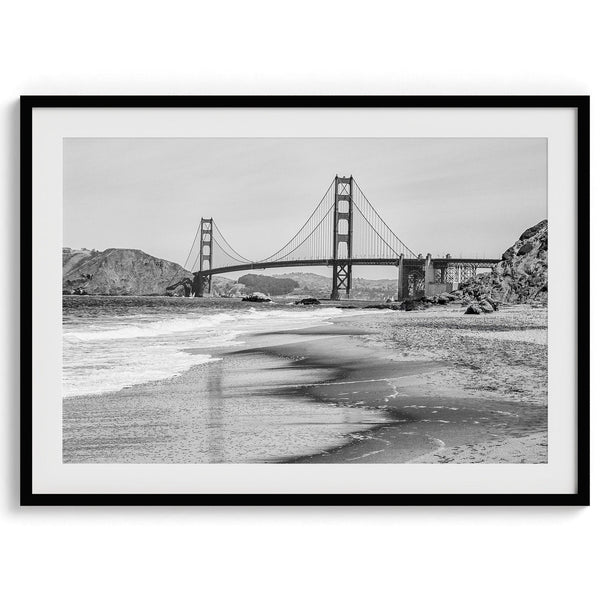 Fine art black and white print of Golden Gate Bridge from Baker Beach, San Francisco. Bridge with reflection in beach surf. Framed or unframed option available