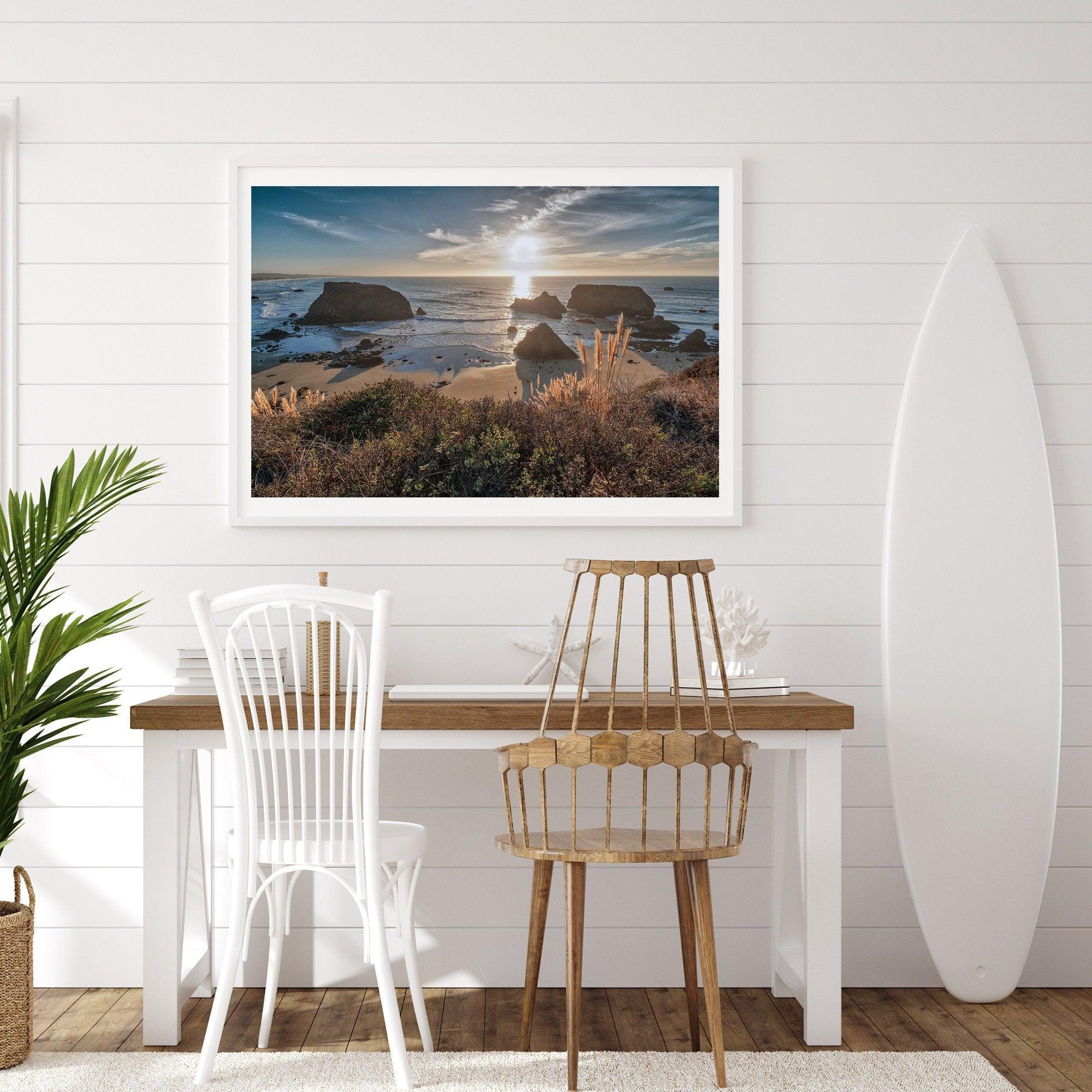 A fine art unframed or framed beach print showing the breathtaking beach of Fort Bragg, California, as the sunset ray of lights hits the ocean and the vast sea stacks.