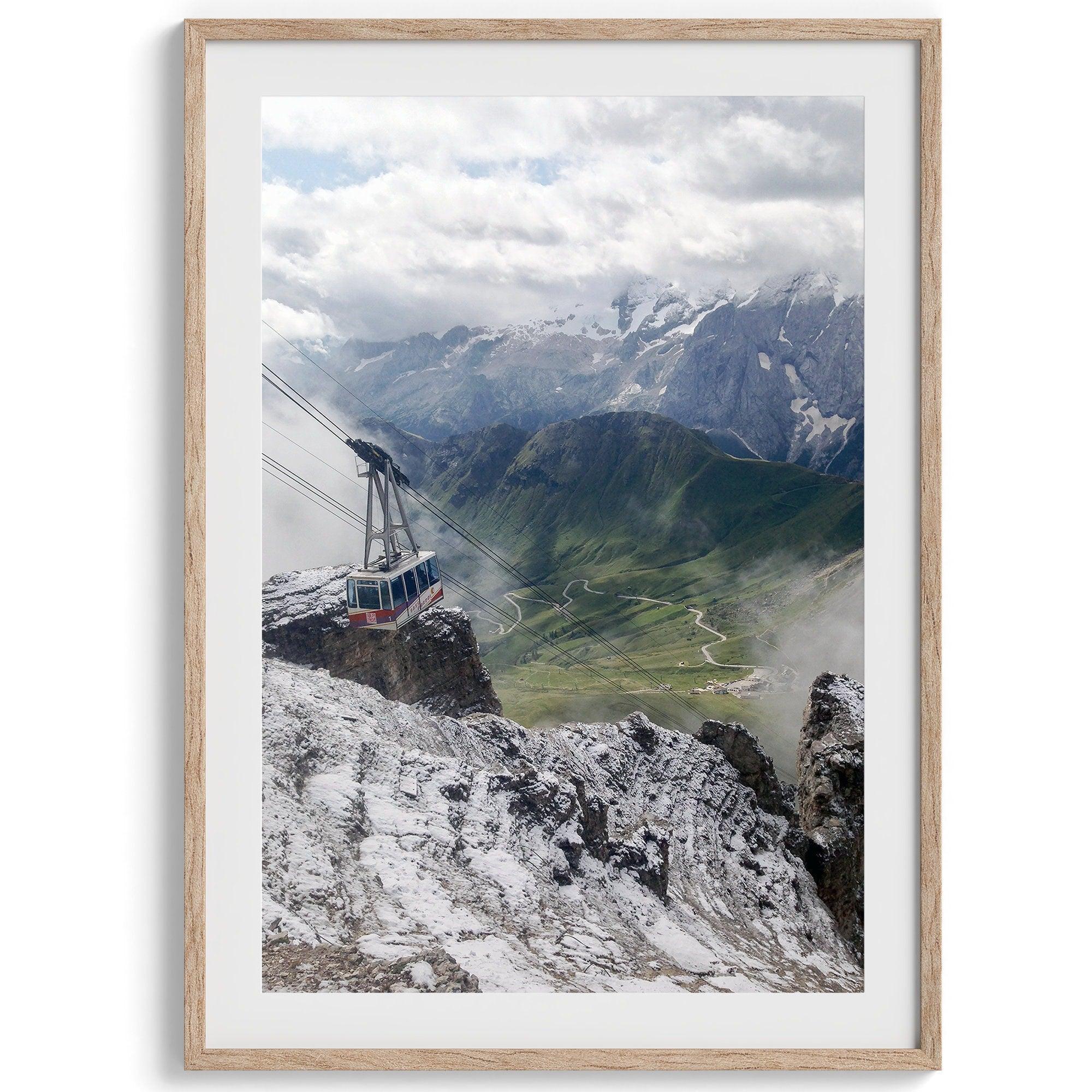 Step into the breathtaking view from the top of Pordoi Pass in the Dolomites Mountains with this fine art Northern Italy photography print. This mountain wall art showcases the green valley and snow-covered mountains.