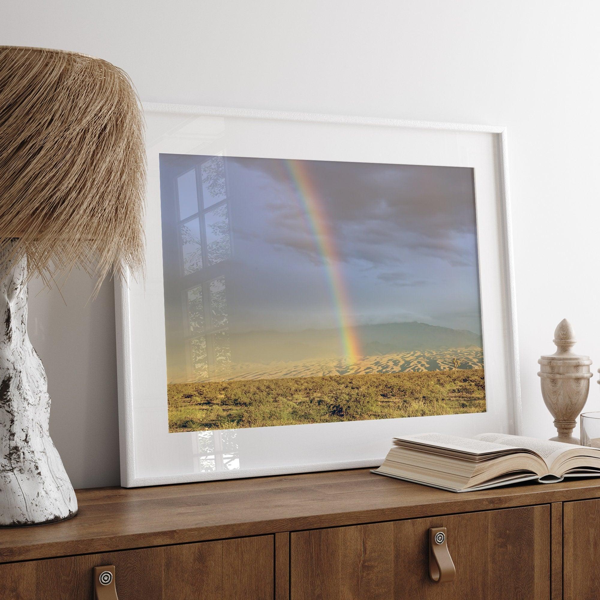 A fine art unframed or framed Arizona desert print showcasing a beautiful rainbow and cloudy sky in the middle of the desert landscape.