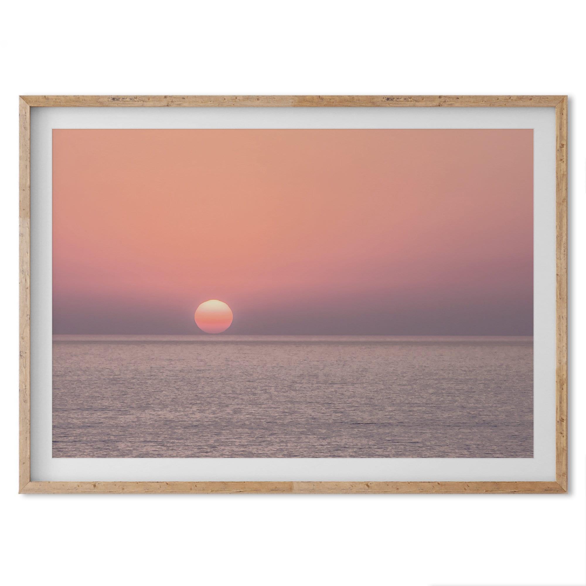 A fine art abstract ocean sunset print featuring rich shades of red, orange, and pink. This ocean wall art will add warmth and beauty to any room in your home.