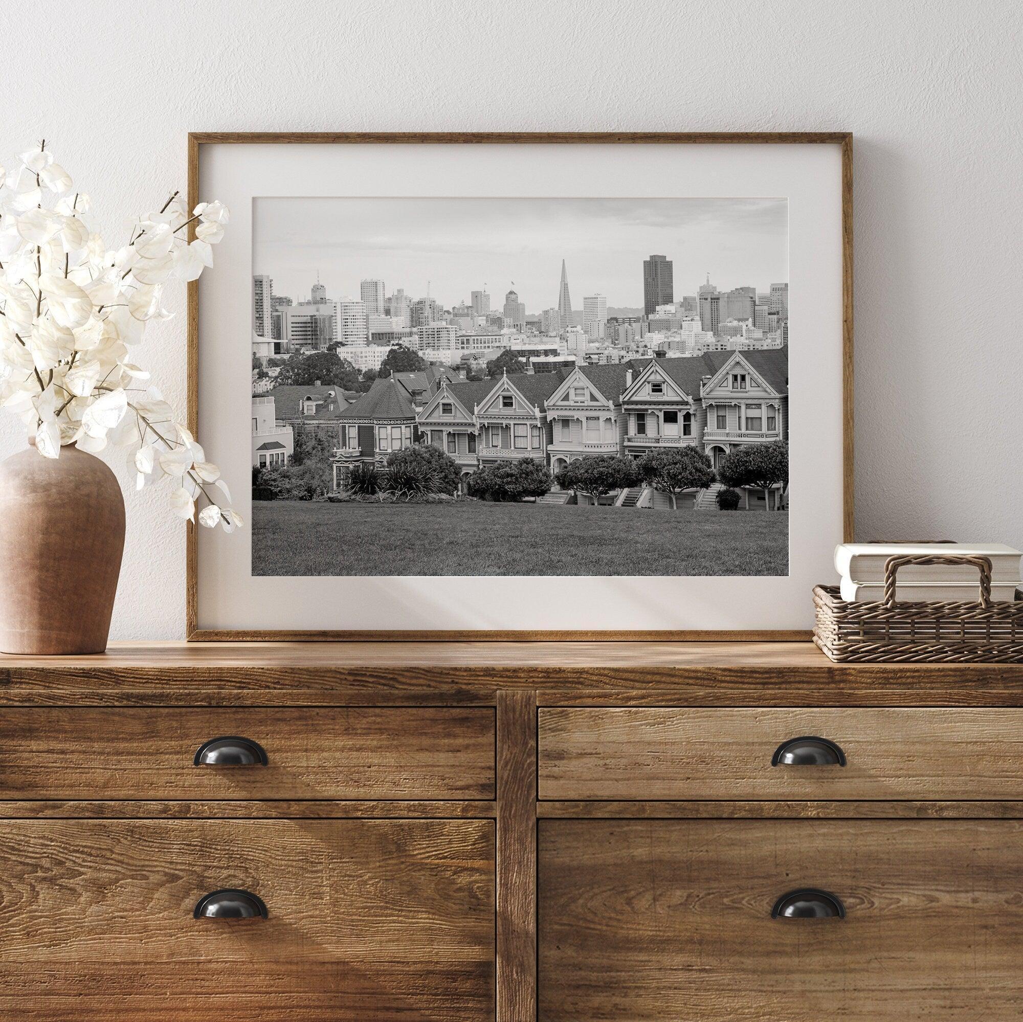 A fine art framed print of the famous colorful painted Ladies Victorian houses in Alamo Square, San Francisco.