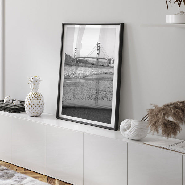 A fine art black and white print of the Golden Gate Bridge in San Francisco. This photo was taken from Baker Beach, showing the beautiful reflection of the bridge in the ocean. It is an excellent addition to your wall decor or a San Francisco gift.