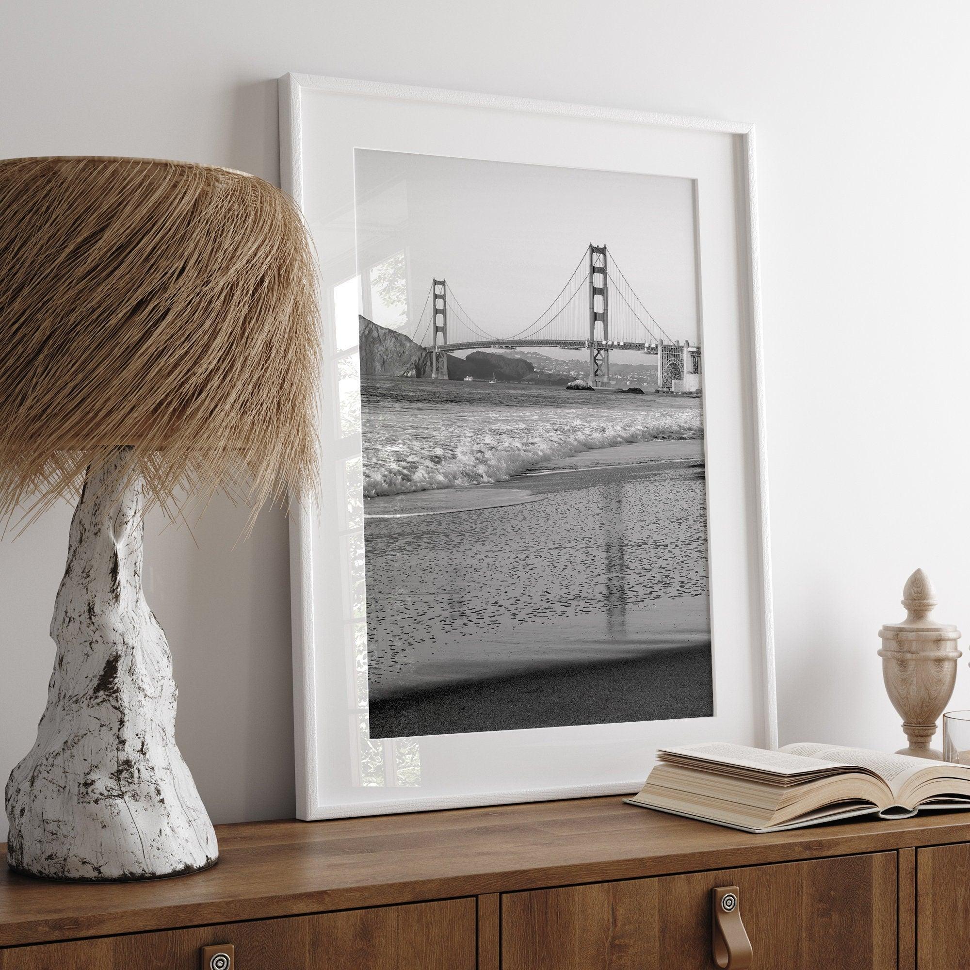 A fine art black and white print of the Golden Gate Bridge in San Francisco. This photo was taken from Baker Beach, showing the beautiful reflection of the bridge in the ocean. It is an excellent addition to your wall decor or a San Francisco gift.