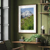 A fine art framed or unframed mountain print of Mount Rainier National Park. This portrait orientation nature landscape wall art showcases the beautiful snow-covered mountain with stunning flowers in the forefront.