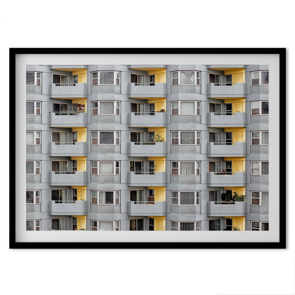 A fine art San Francisco minimalist architecture print of a unique modern building with colorful yellow balconies.