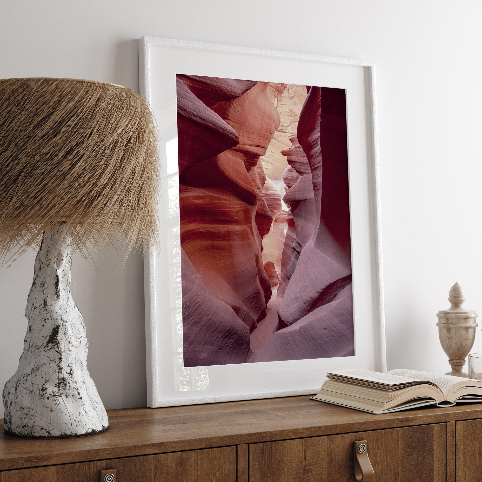 This beautiful Arizona desert wall art captures the mesmerizing beauty of Antelope Canyon. The picture showcases a passage through the rock in the canyon, with vibrant pink and purple textures that create a sense of depth and dimension.