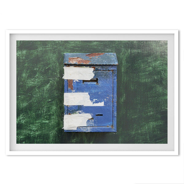 A fine art minimalist photography print of a rustic blue Mediterranean mail box on a green washed-out wall. great color addition to your wall decor.