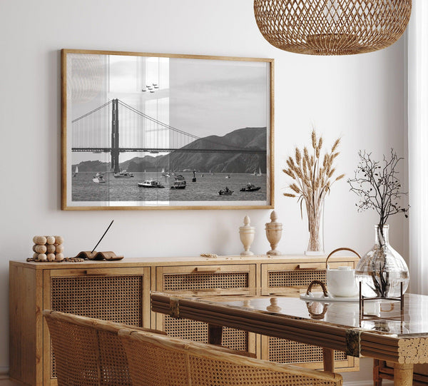 A fine art black and white San Francisco print featuring the golden gate bridge with the blue angels f18 jet fighters flying above it during fleet week.