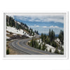 An unframed or framed fine art print of a mountain in Lassen National Park, Featuring a winding road through the lush forest and snow covered mountain.