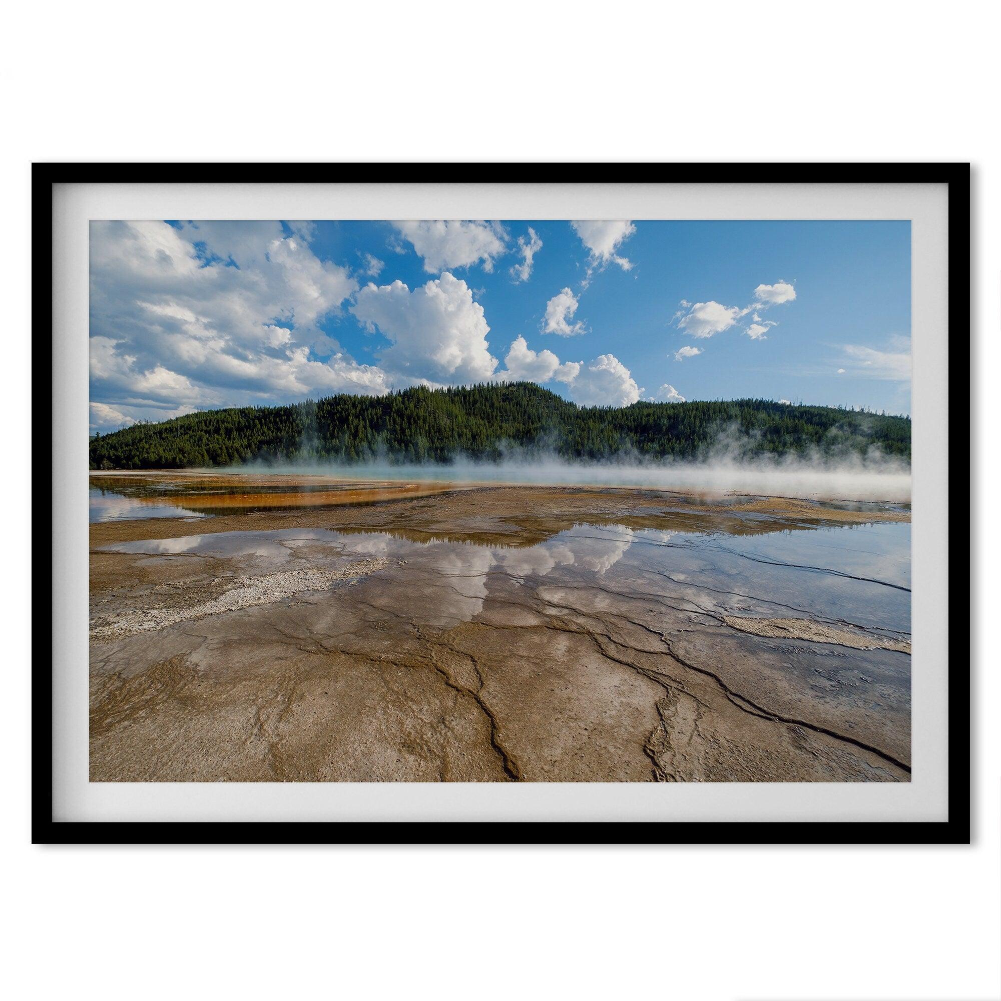 A fine art framed or unframed print of the stunning Grant Prismatic hot springs in Yellowstone National Park. This nature wall art showcases the beautiful geometrical shapes and cloud reflections in the hot spring water.