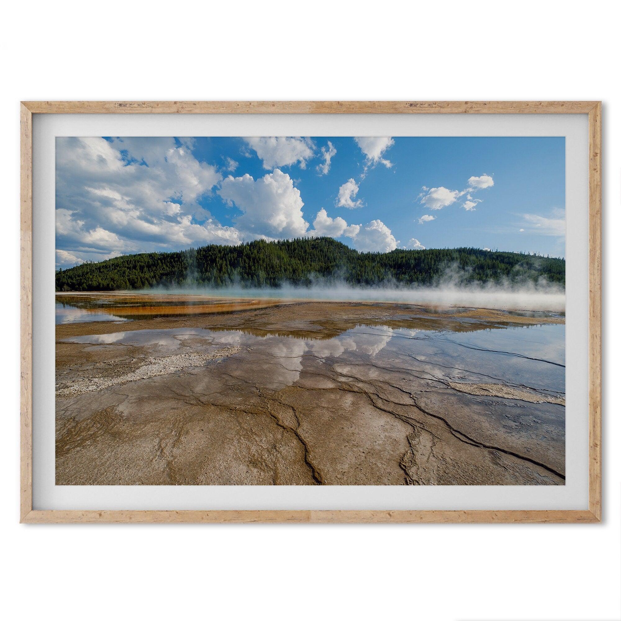 A fine art framed or unframed print of the stunning Grant Prismatic hot springs in Yellowstone National Park. This nature wall art showcases the beautiful geometrical shapes and cloud reflections in the hot spring water.