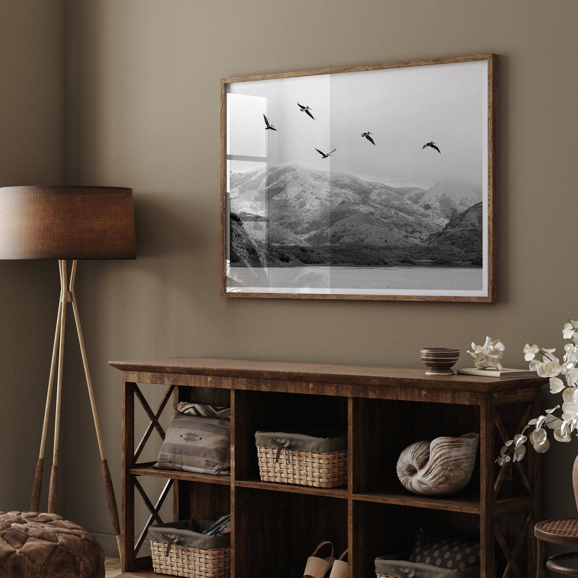 A Fine art black and white beach print of a California beach lagoon with foggy coastal mountains, and pelicans in flight - modern coastal wall art for beach house decor