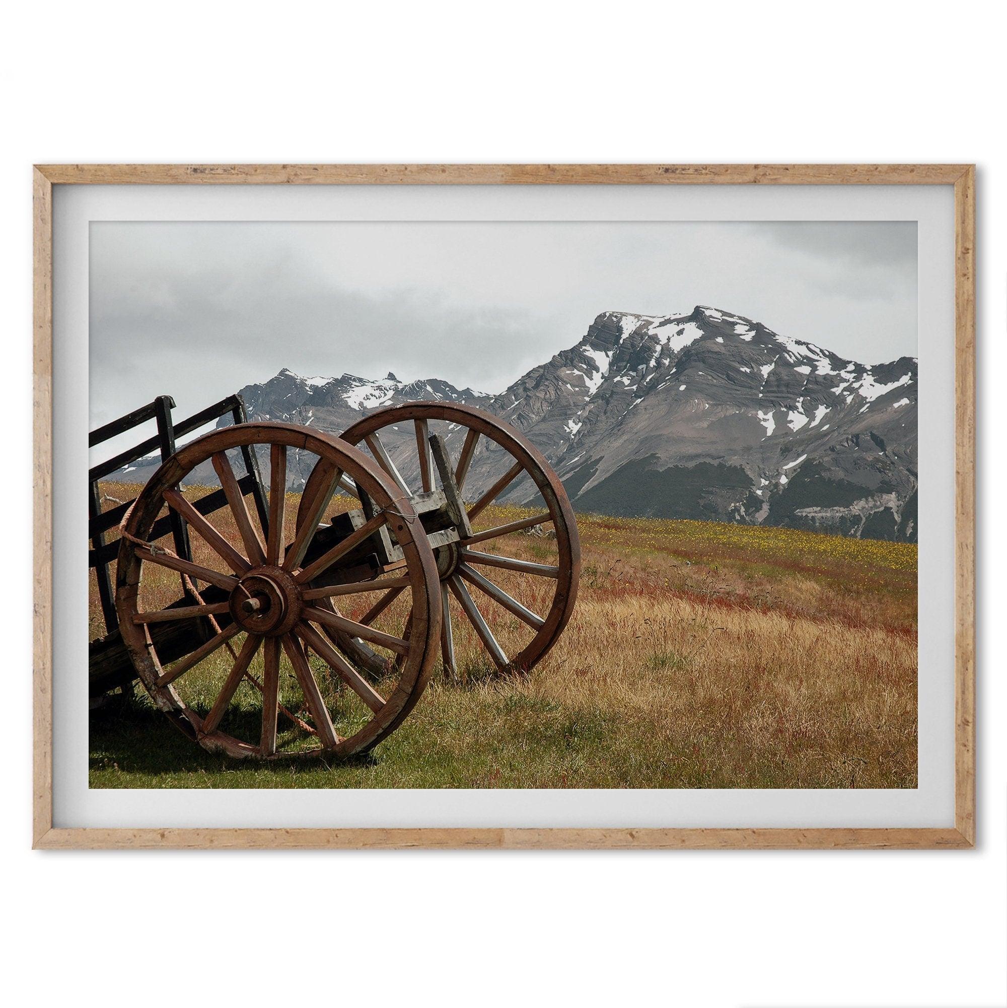 A fine art print of an old plower in the meadows of Patagonia, Argentina, with the backdrop of snow-covered mountains.