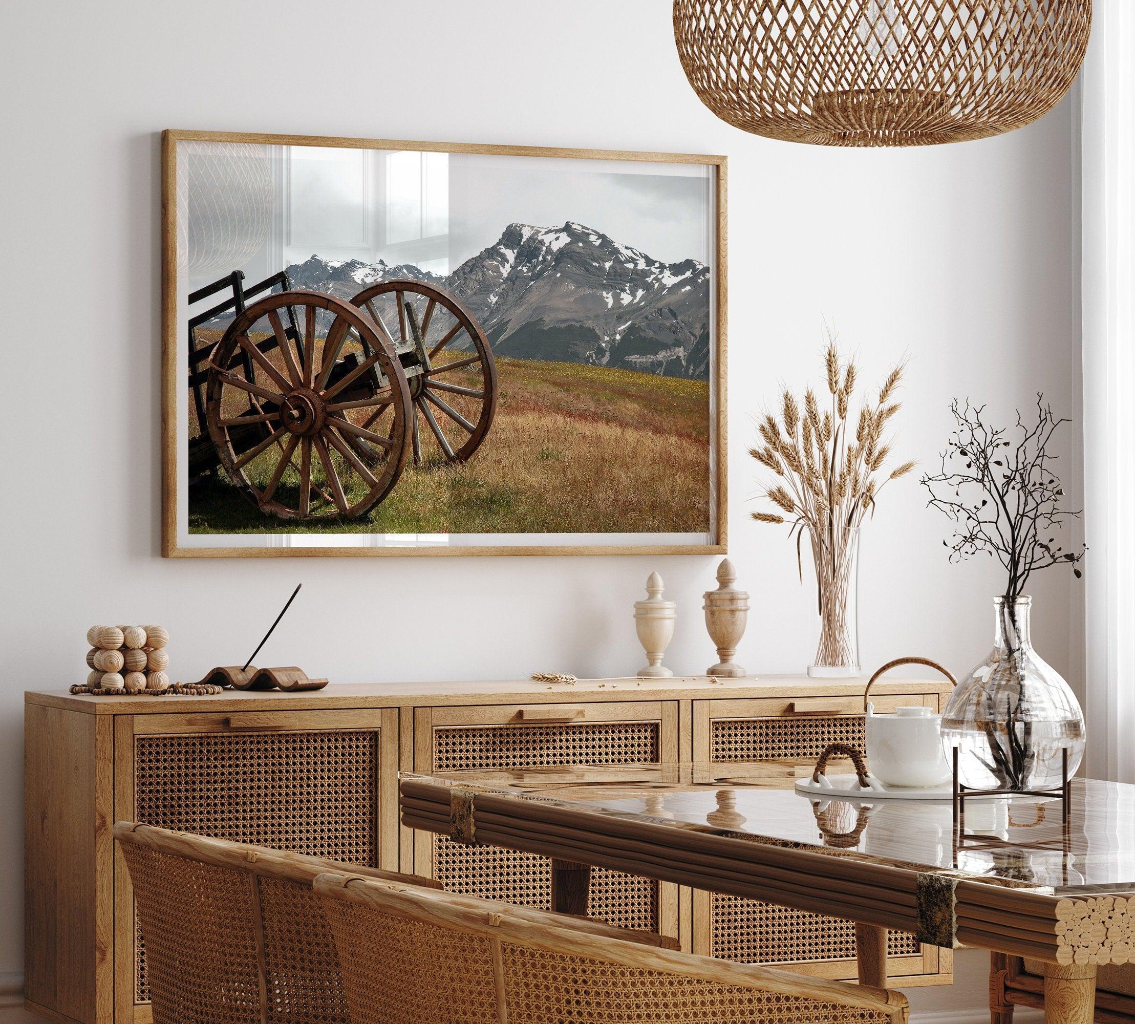 A fine art print of an old plower in the meadows of Patagonia, Argentina, with the backdrop of snow-covered mountains.