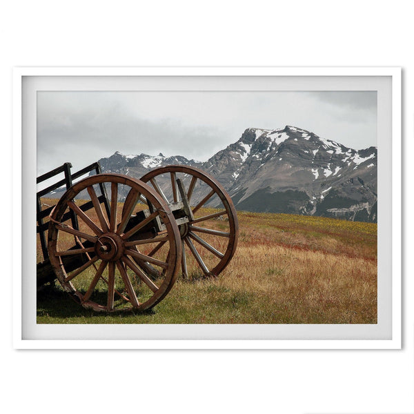 A fine art print of an old plower in the meadows of Patagonia, Argentina, with the backdrop of snow-covered mountains.